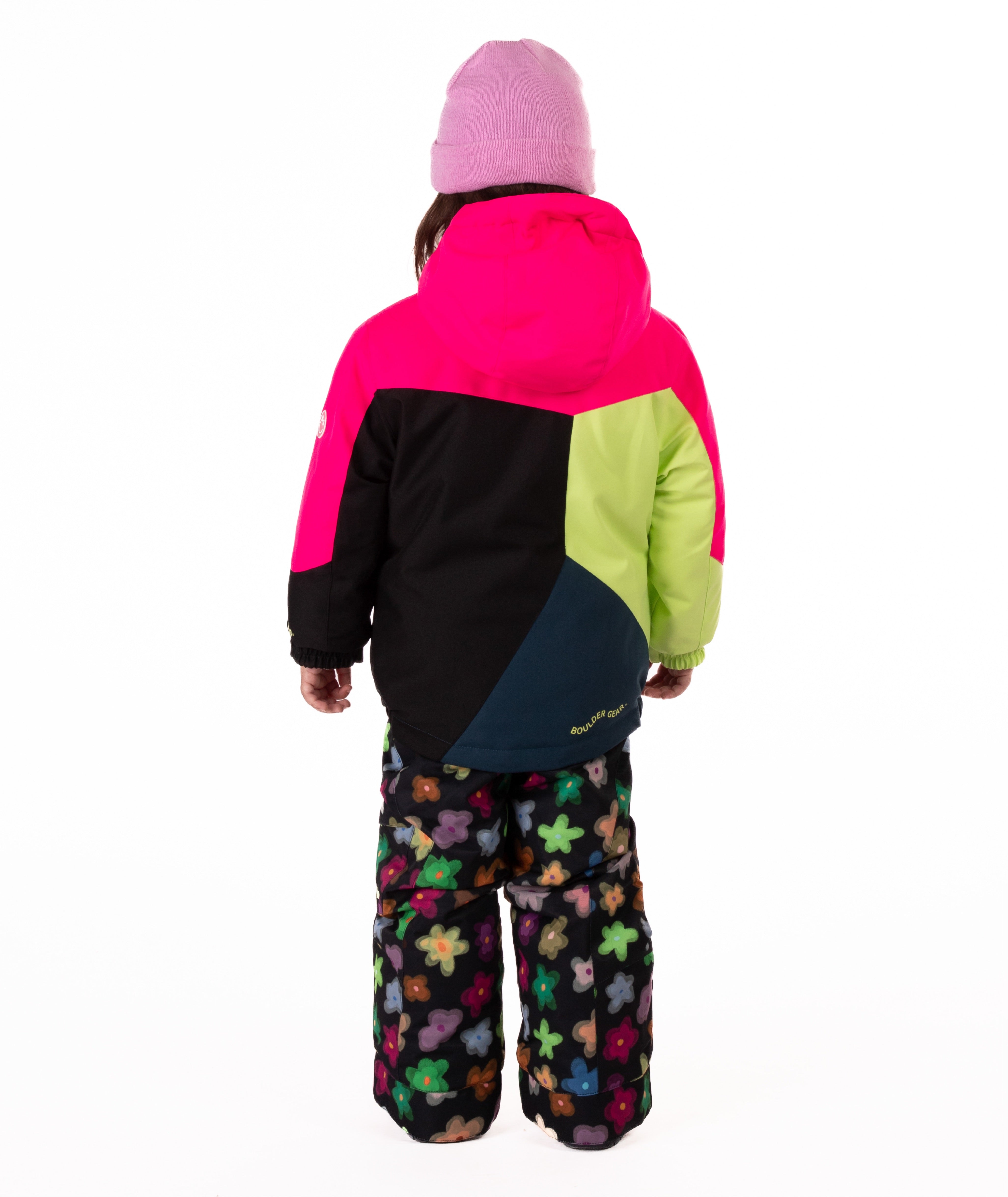 Child wearing a colorful jacket with bright pink, green, black, and navy colors on a white background