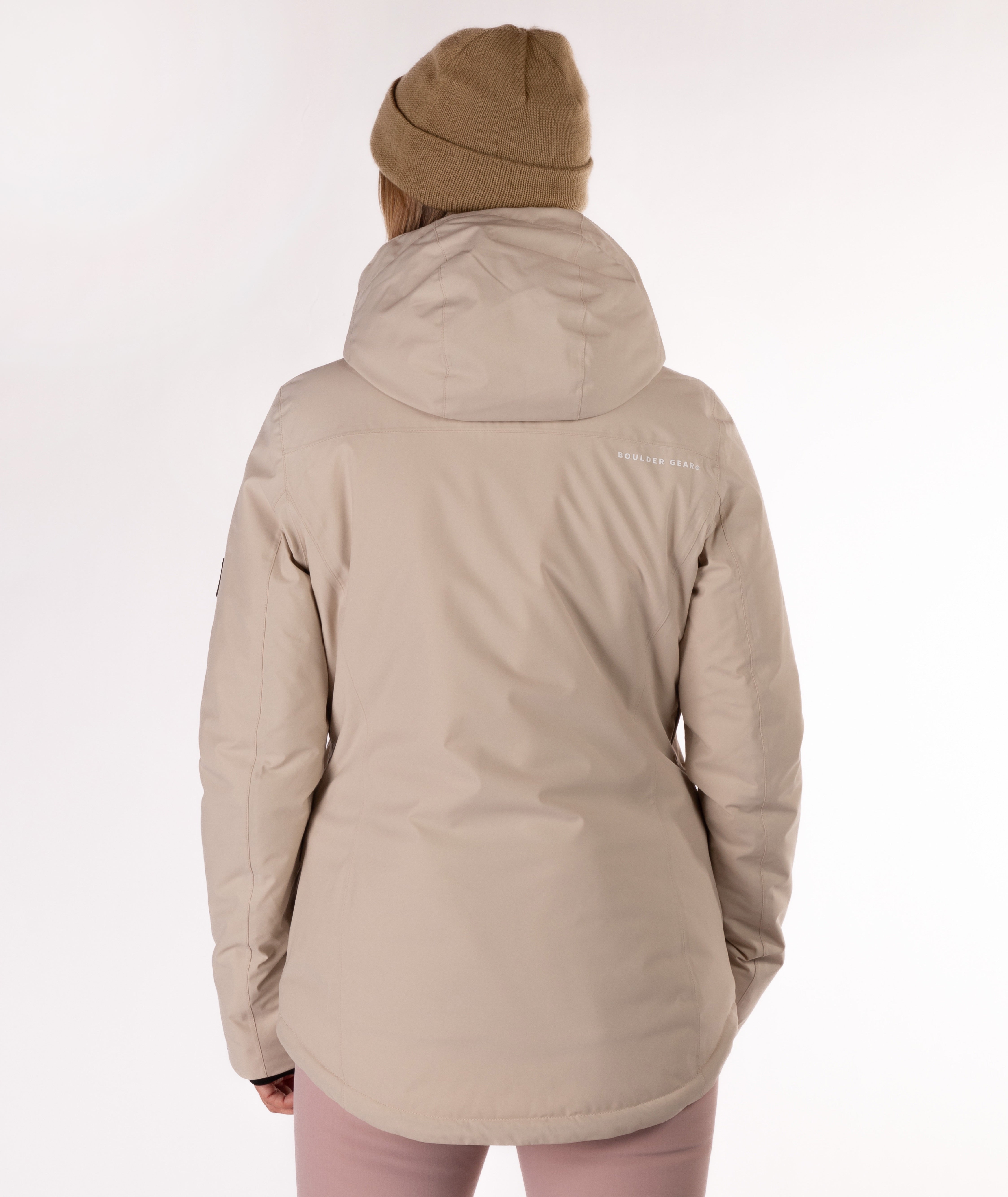 back of a beige jacket worn by a person on a white background