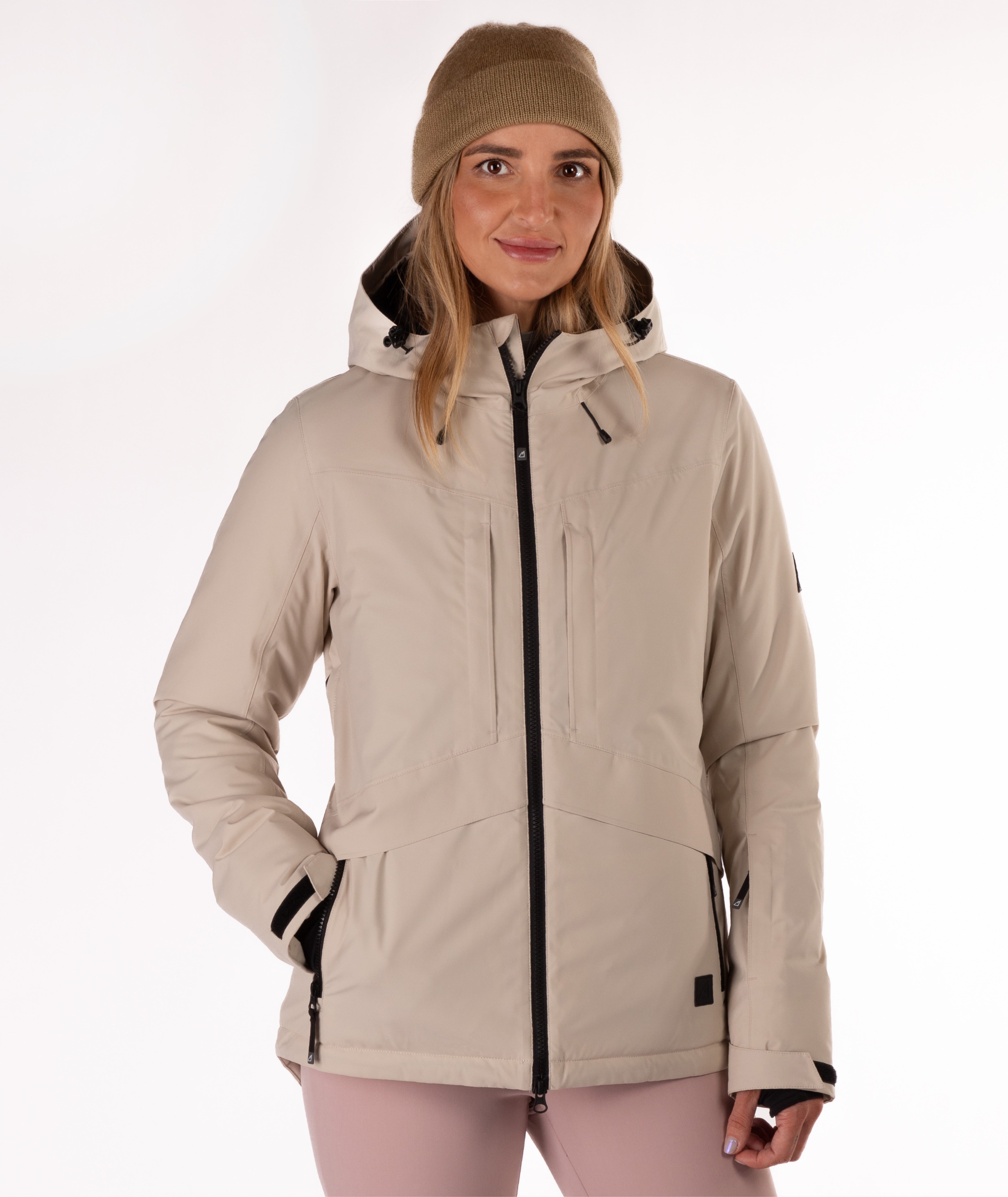 Woman wearing a beige winter jacket on a white background
