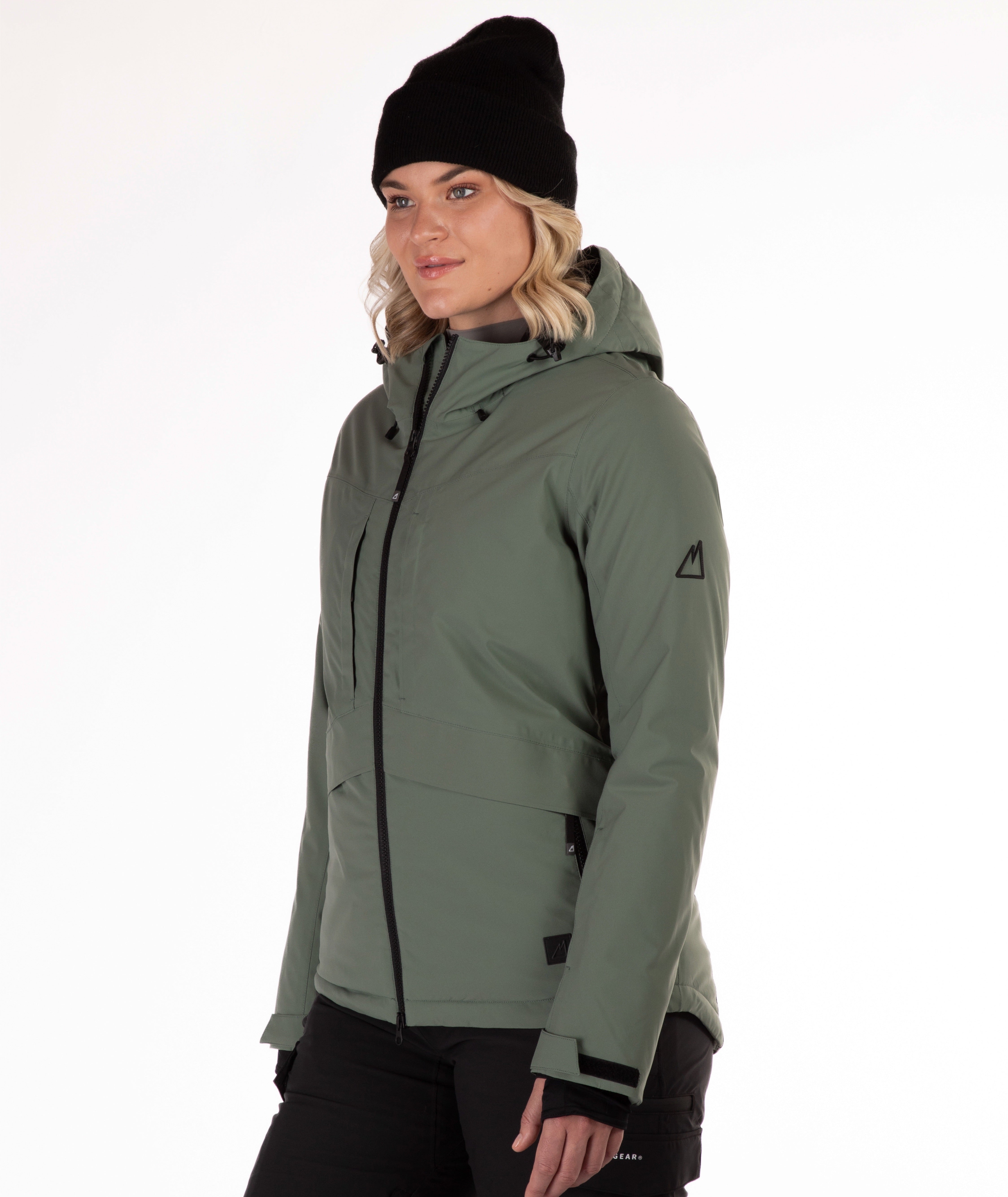 Woman wearing a green winter jacket on a white background
