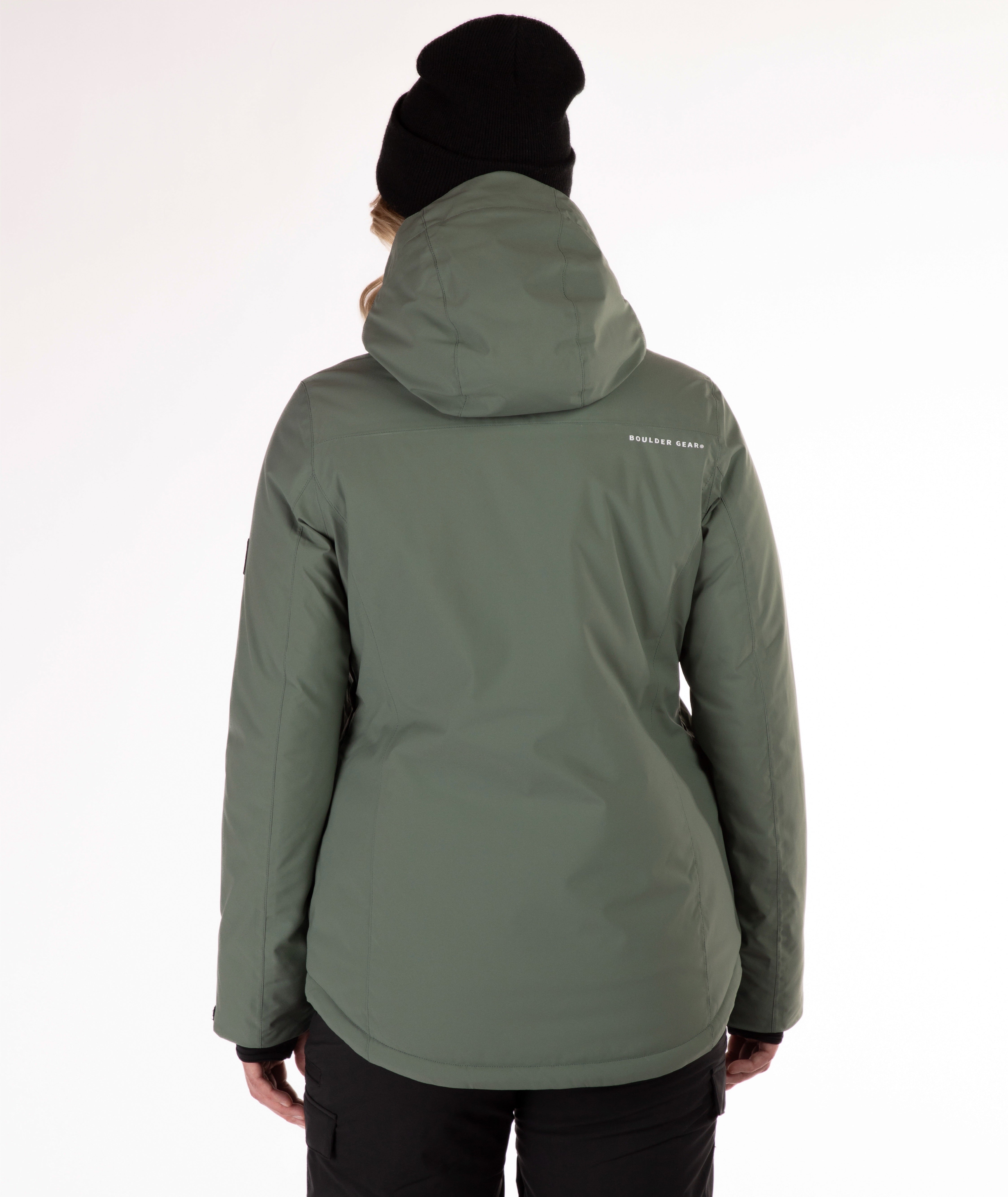 back of woman wearing a green winter jacket on a white background
