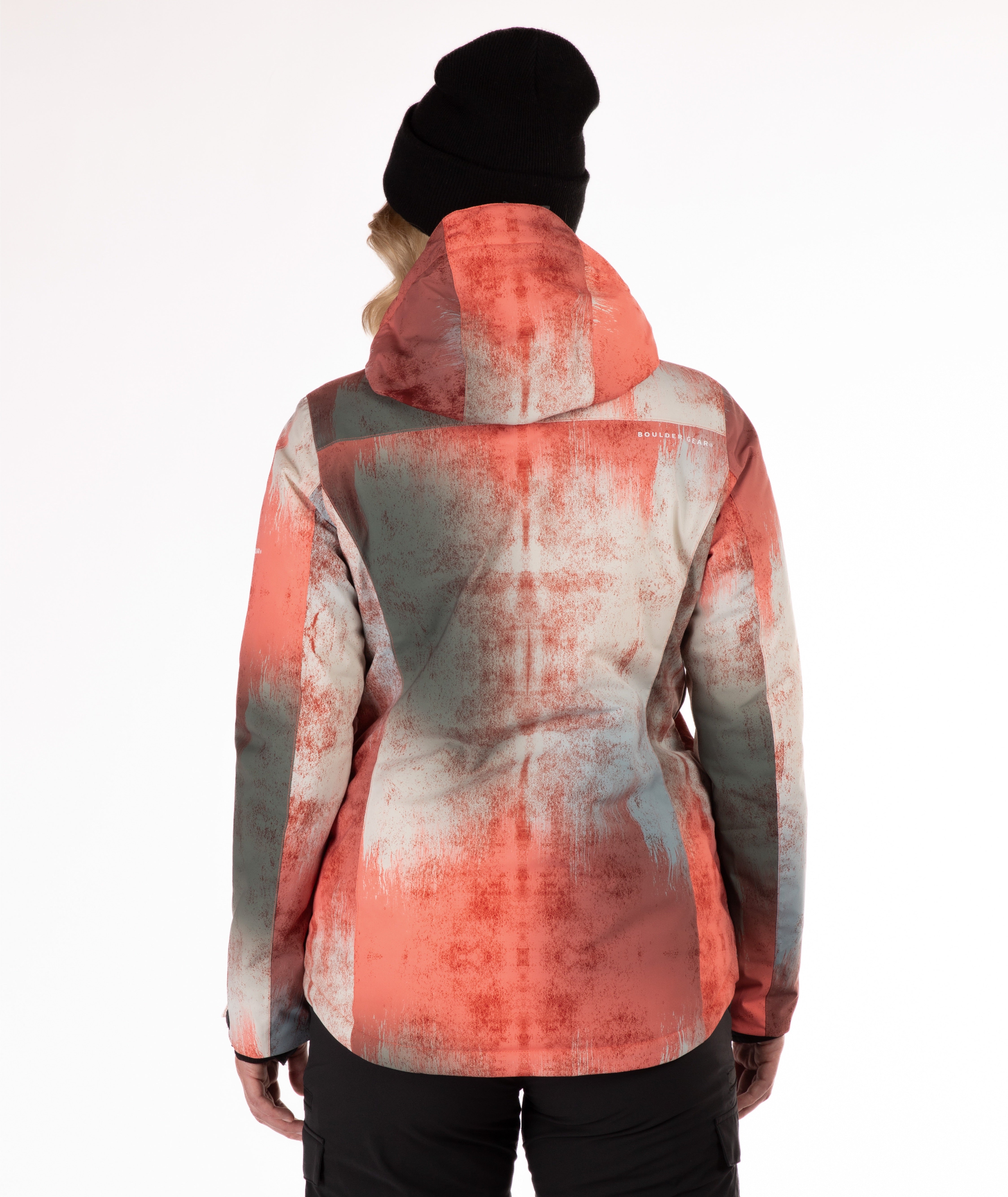 back of a person wearing an abstract printed jacket in primarily rust, gray and beige with a white background
