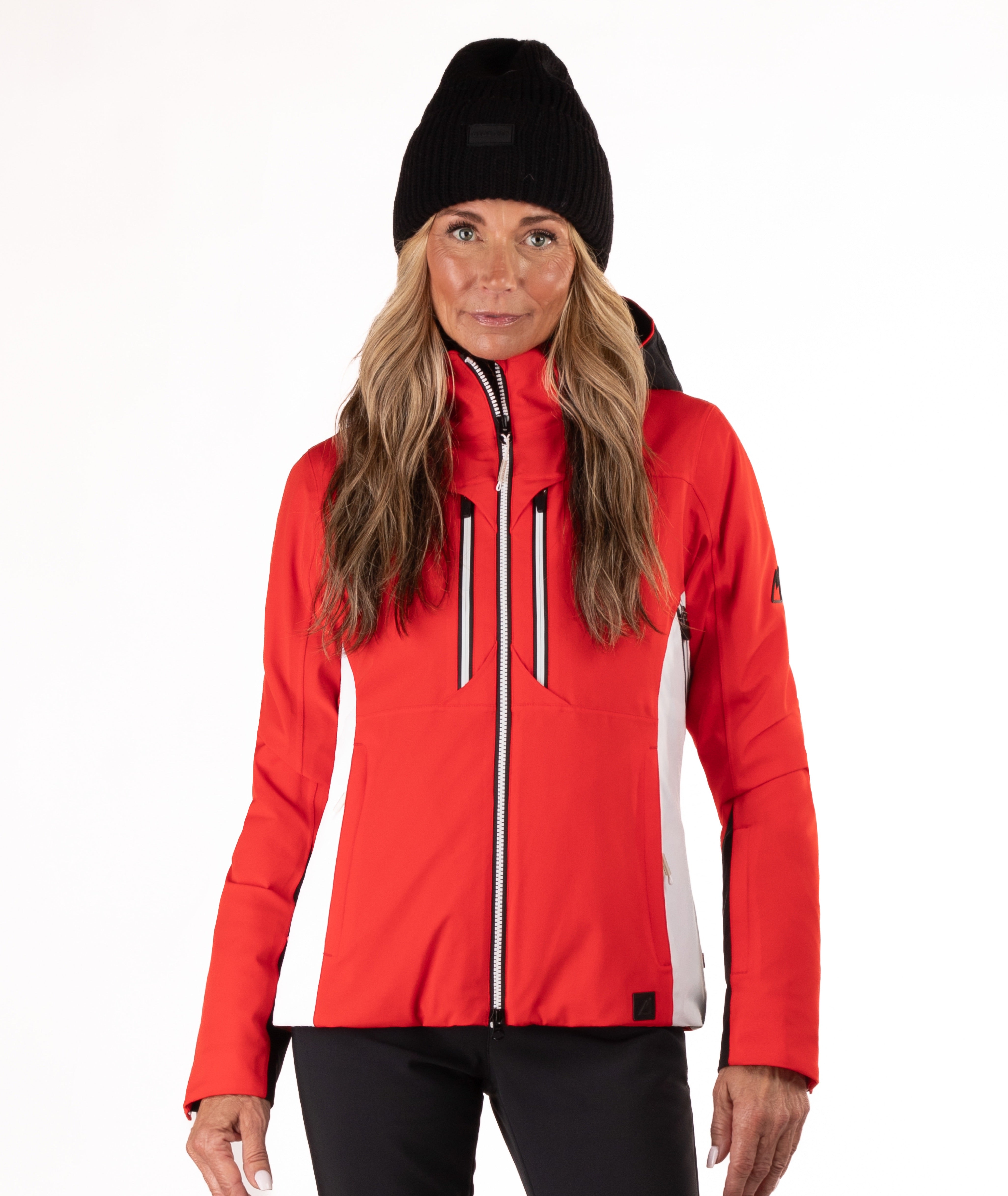 Woman wearing a red and black ski jacket on a white background