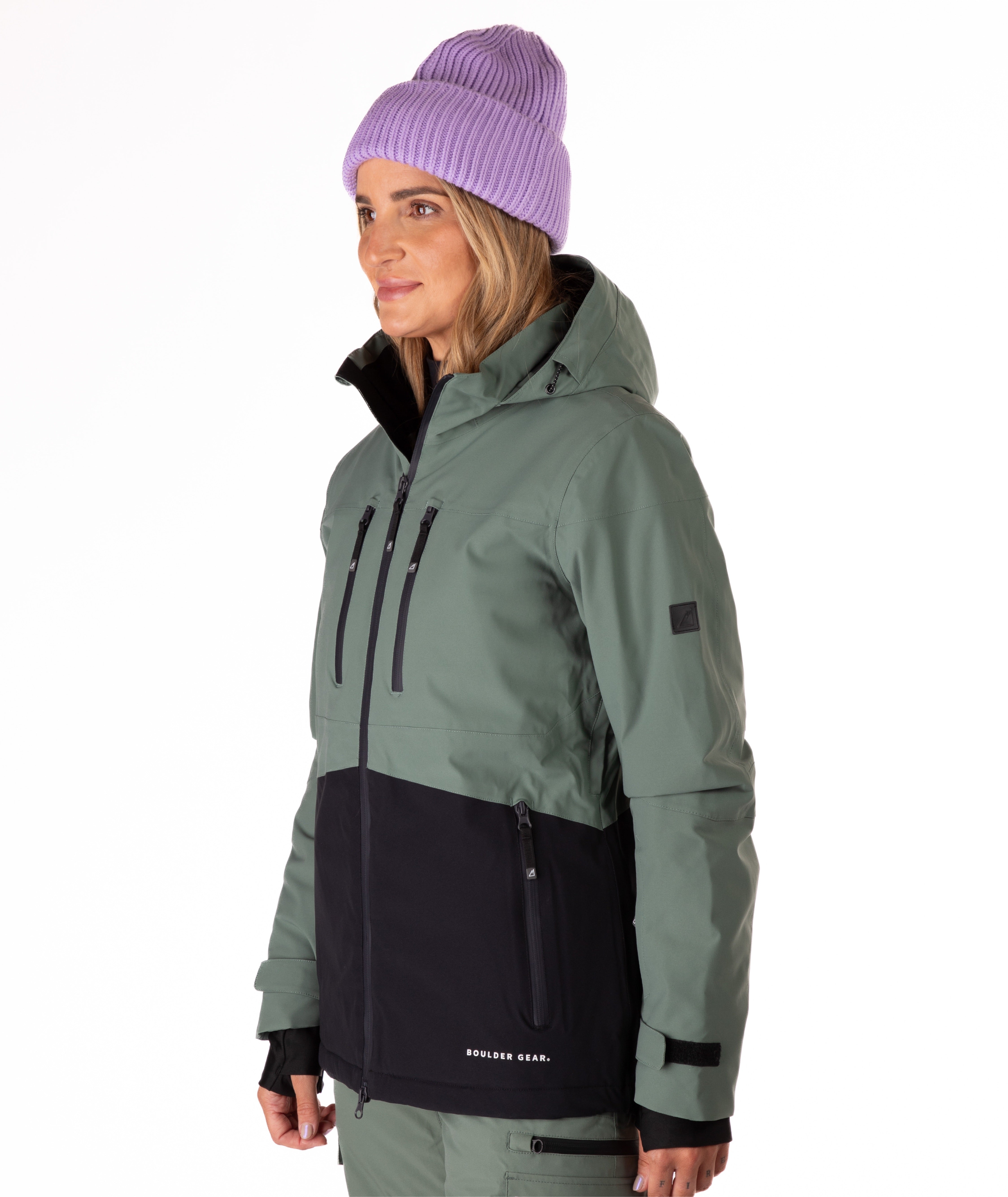 Woman wearing a green and black jacket on a white background