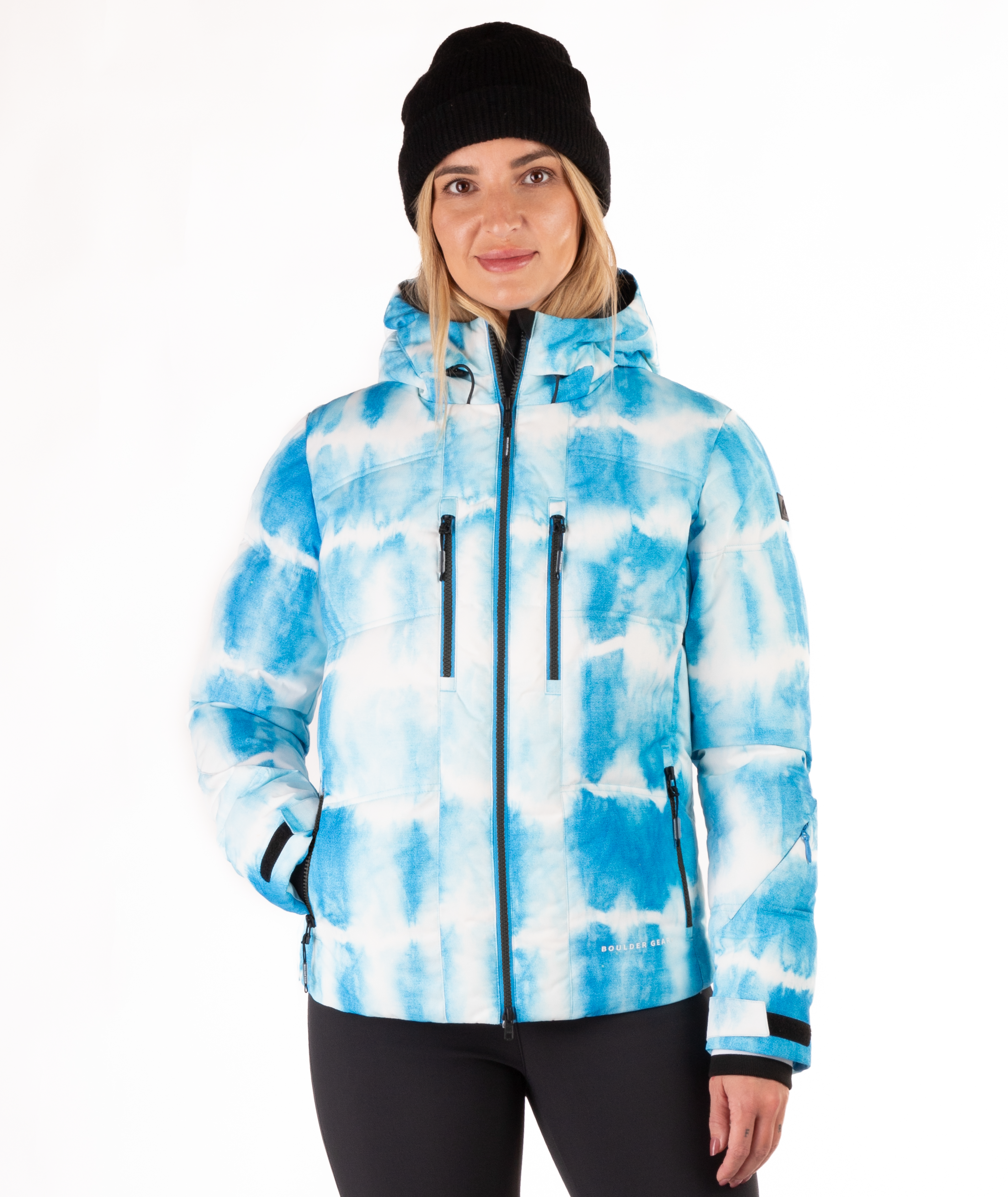 Woman wearing a blue and white tie-died pattern jacket on a white background