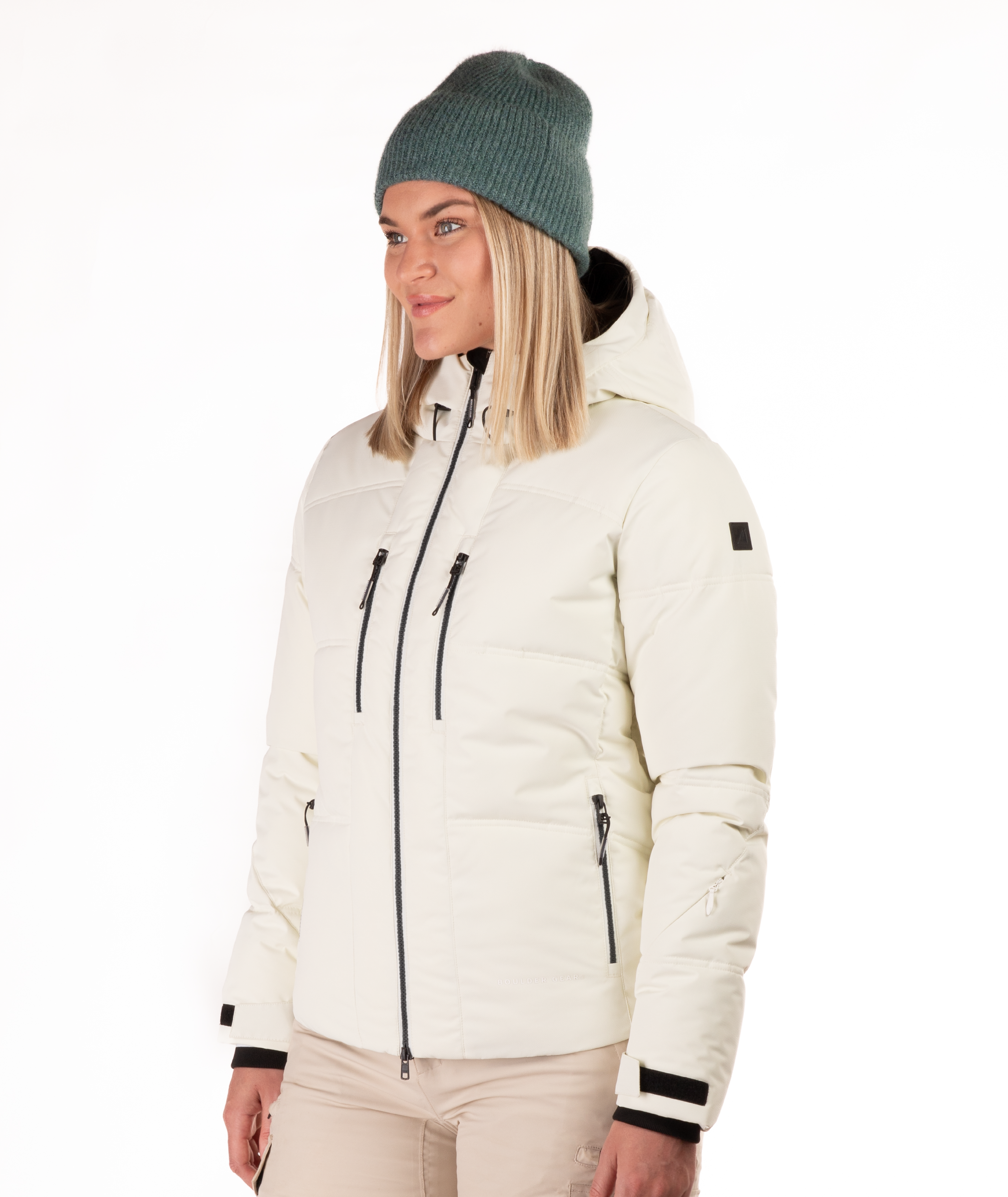 Woman wearing a black quilted winter jacket on a white background