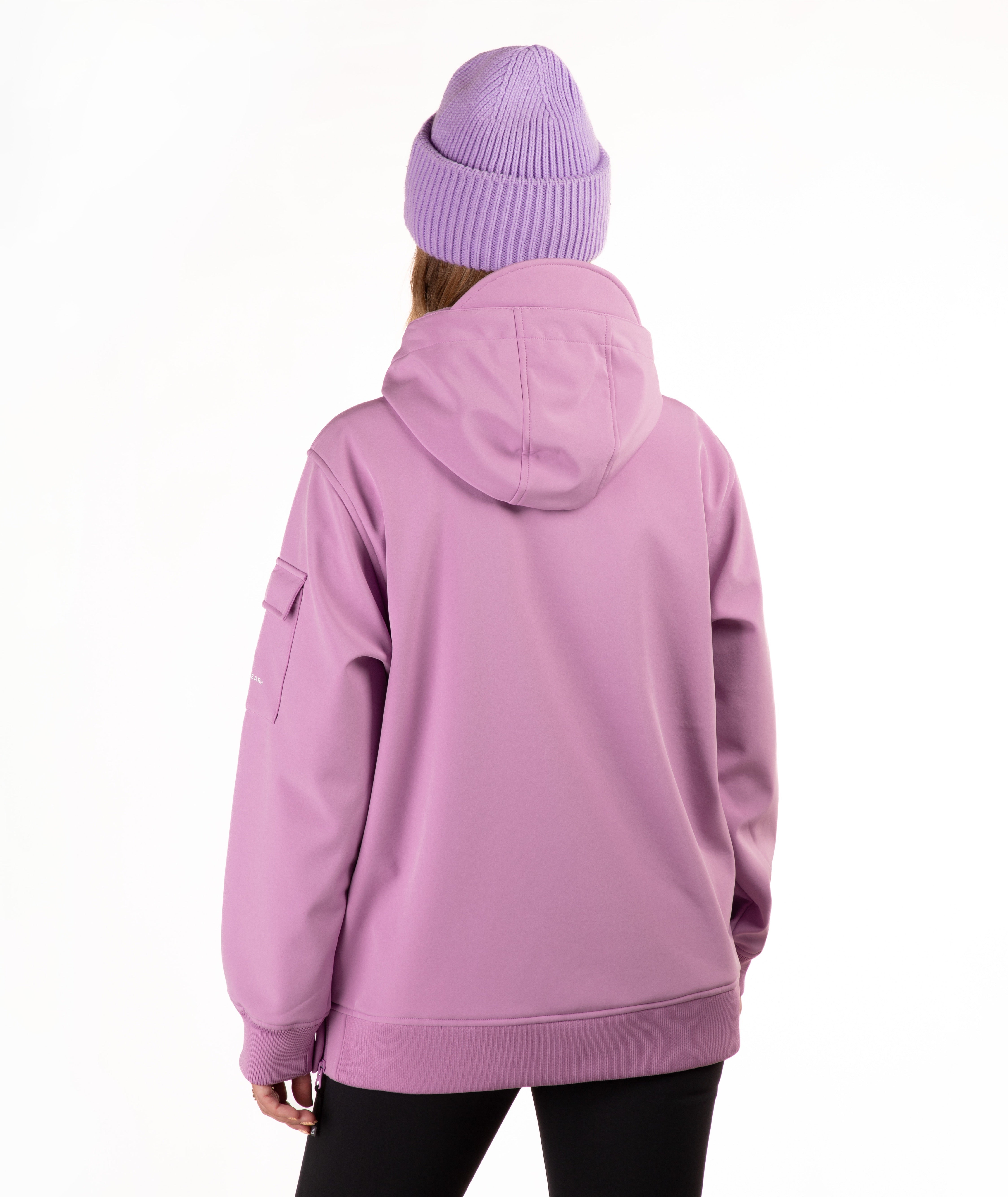 A person shown from the back wearing a lavender-purple hooded jacket and a matching ribbed knit beanie against a plain white studio background.