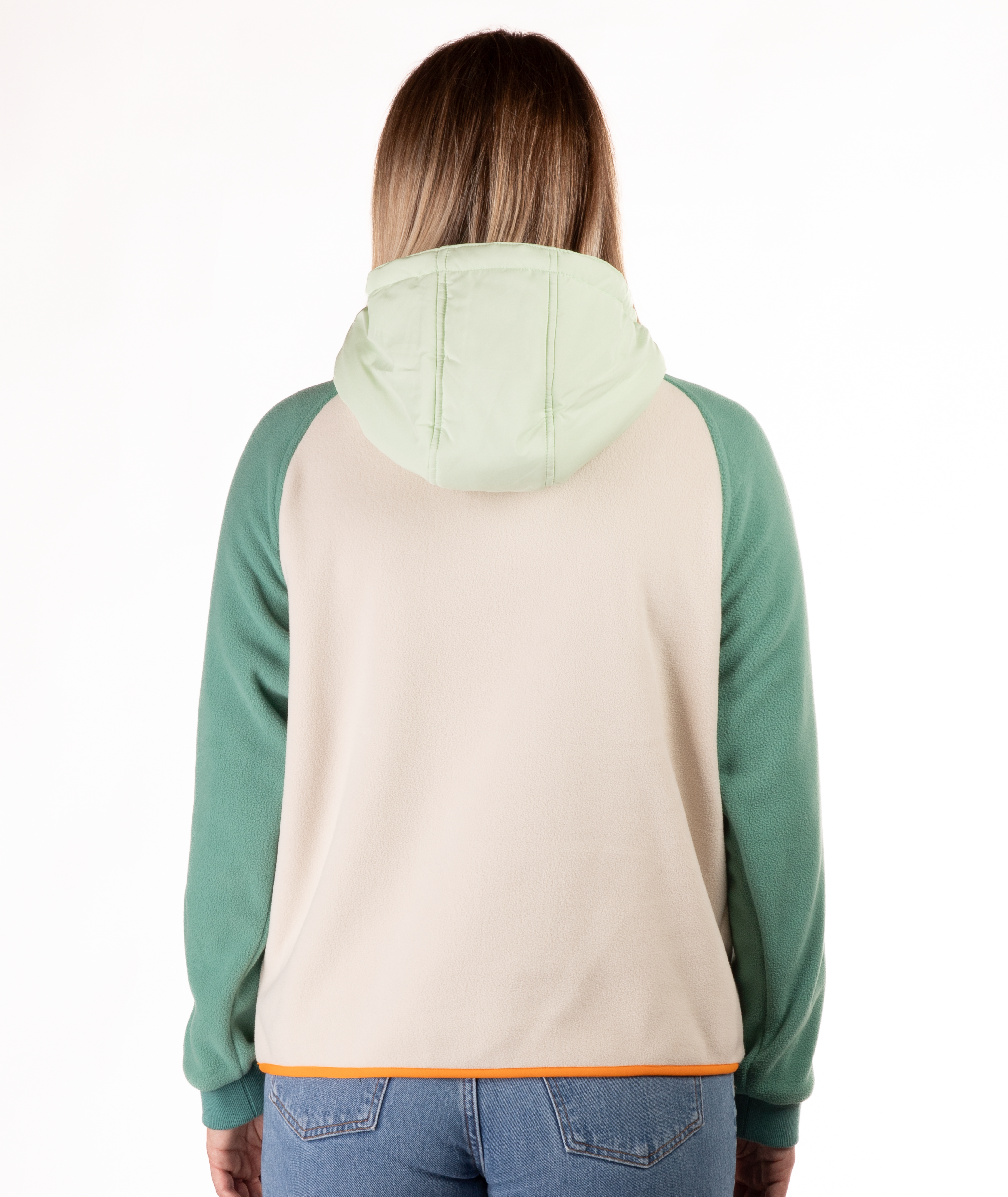 back of woman wearing a green and beige fleece pullover with hood and orange detailing on a white background