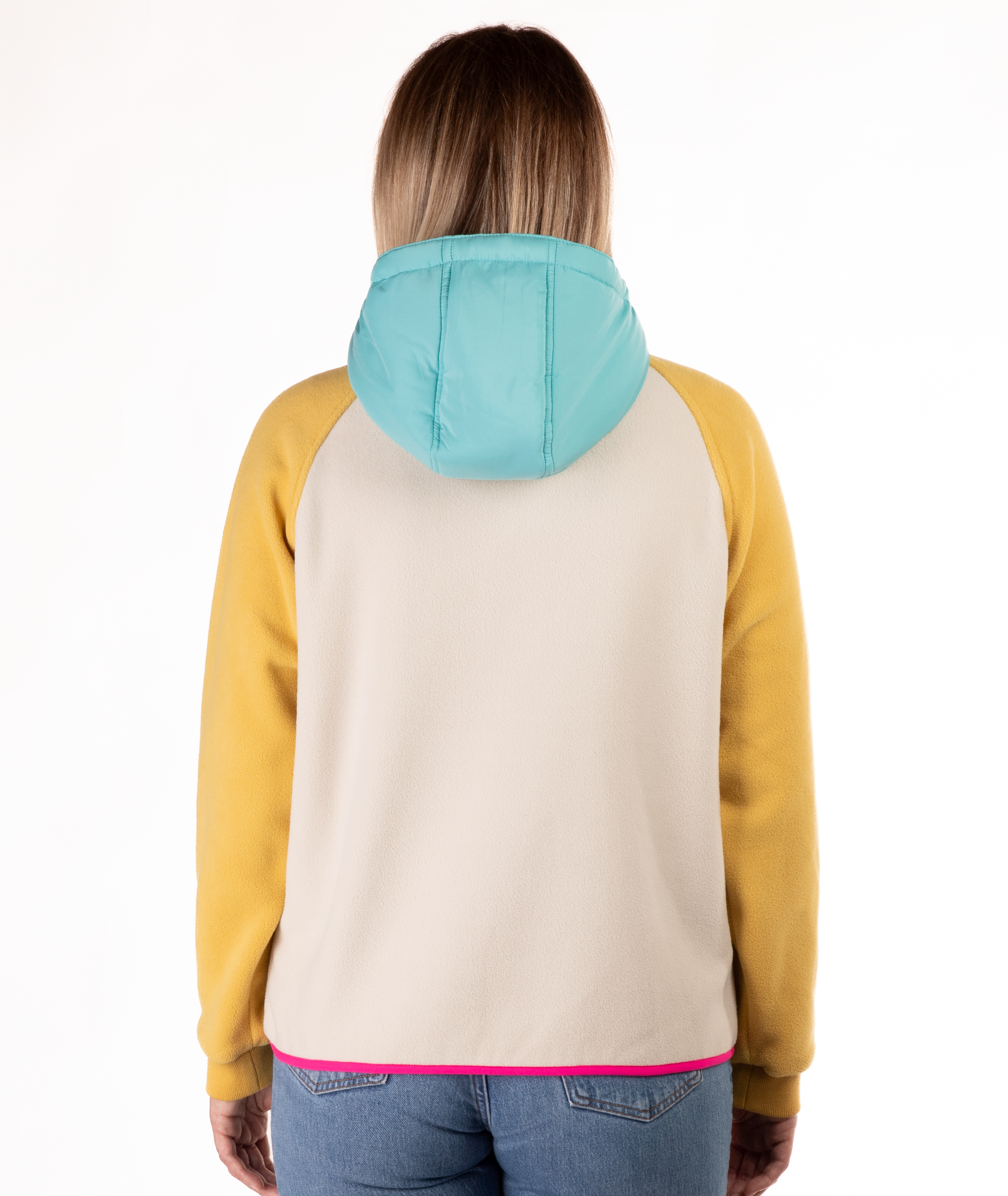 back of woman wearing a yellow, blue and beige fleece pullover with hood and pink detailing on a white background