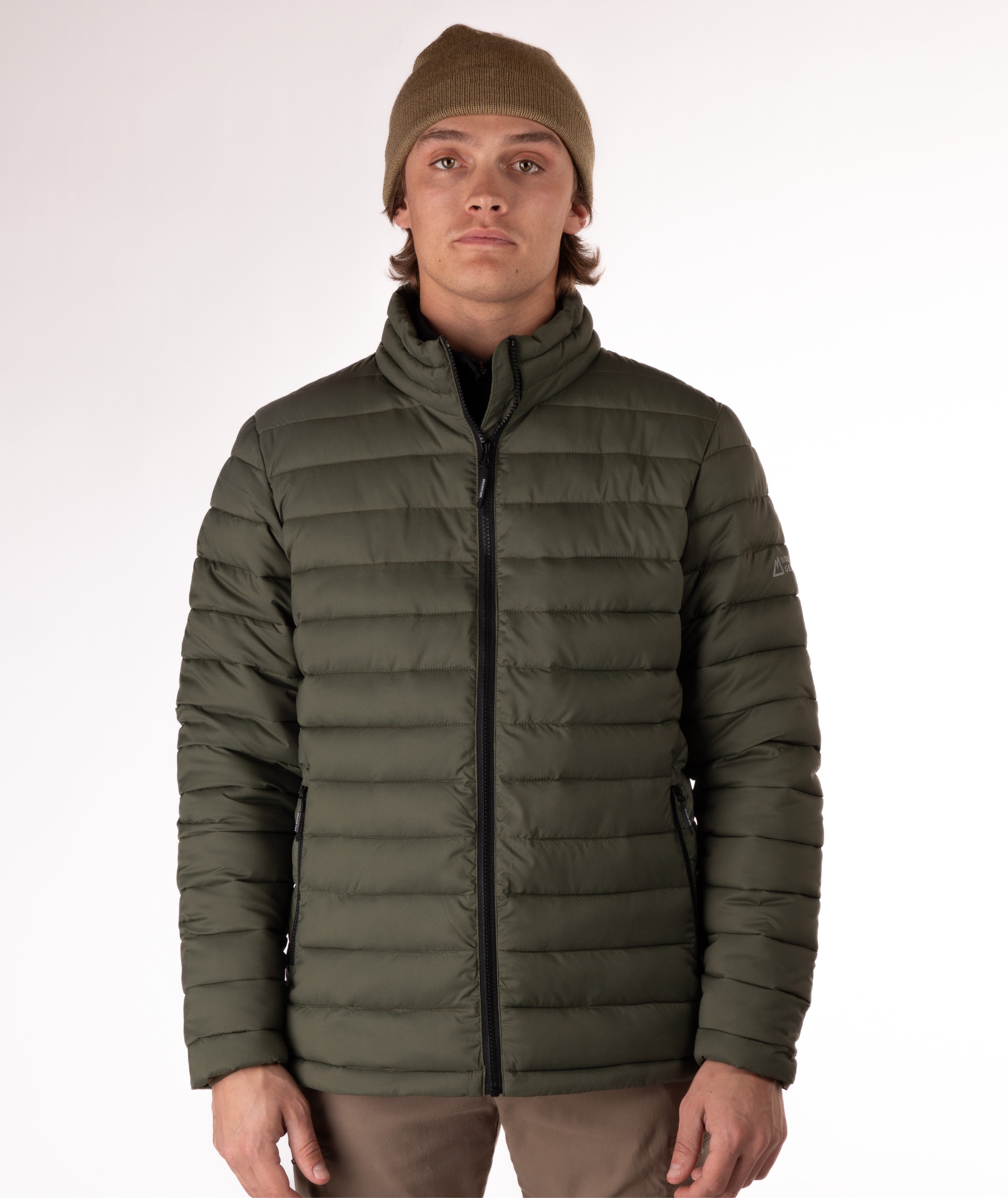 Man wearing a green puffer jacket on a white background