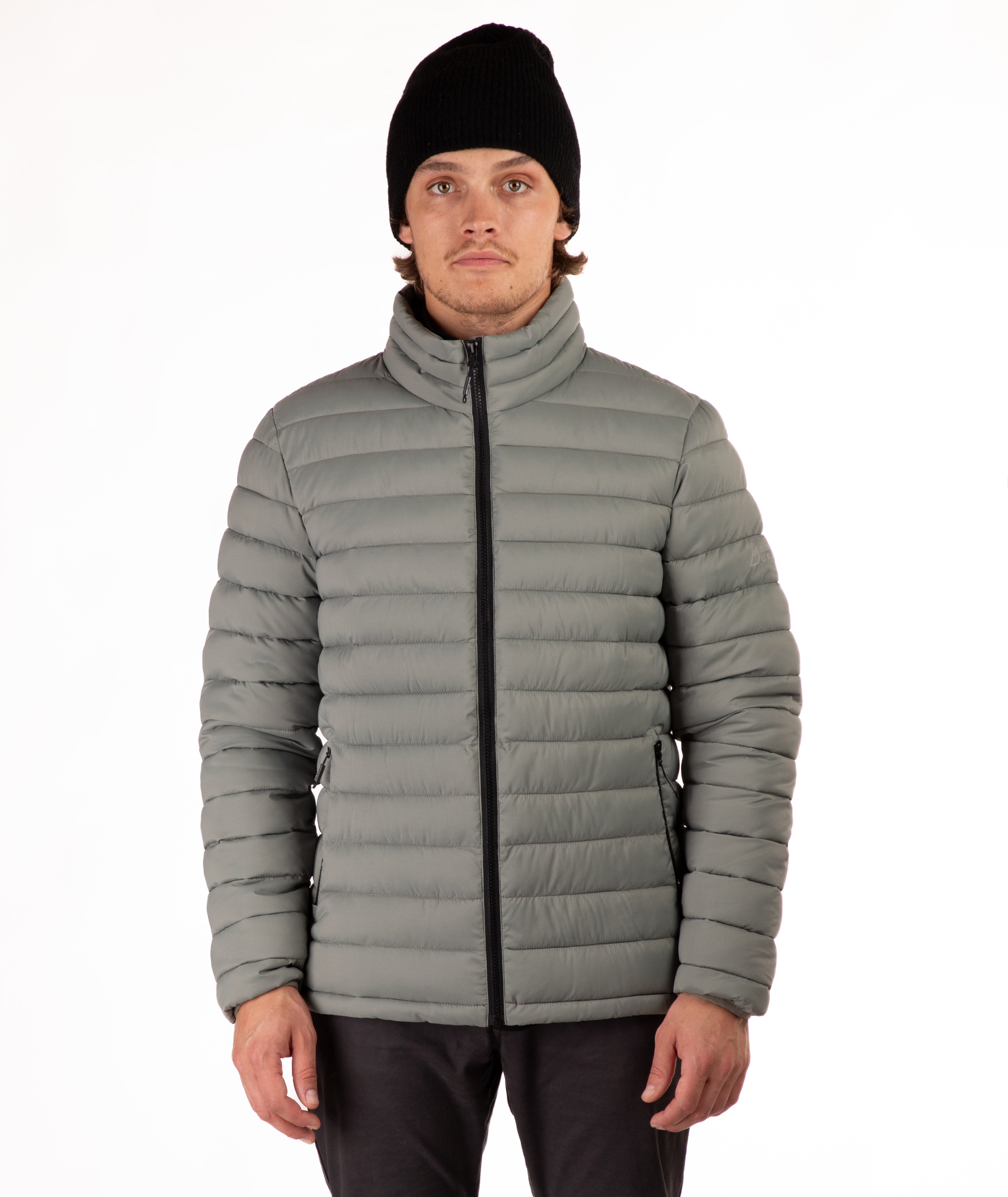 Man wearing a beige puffer jacket on a white background