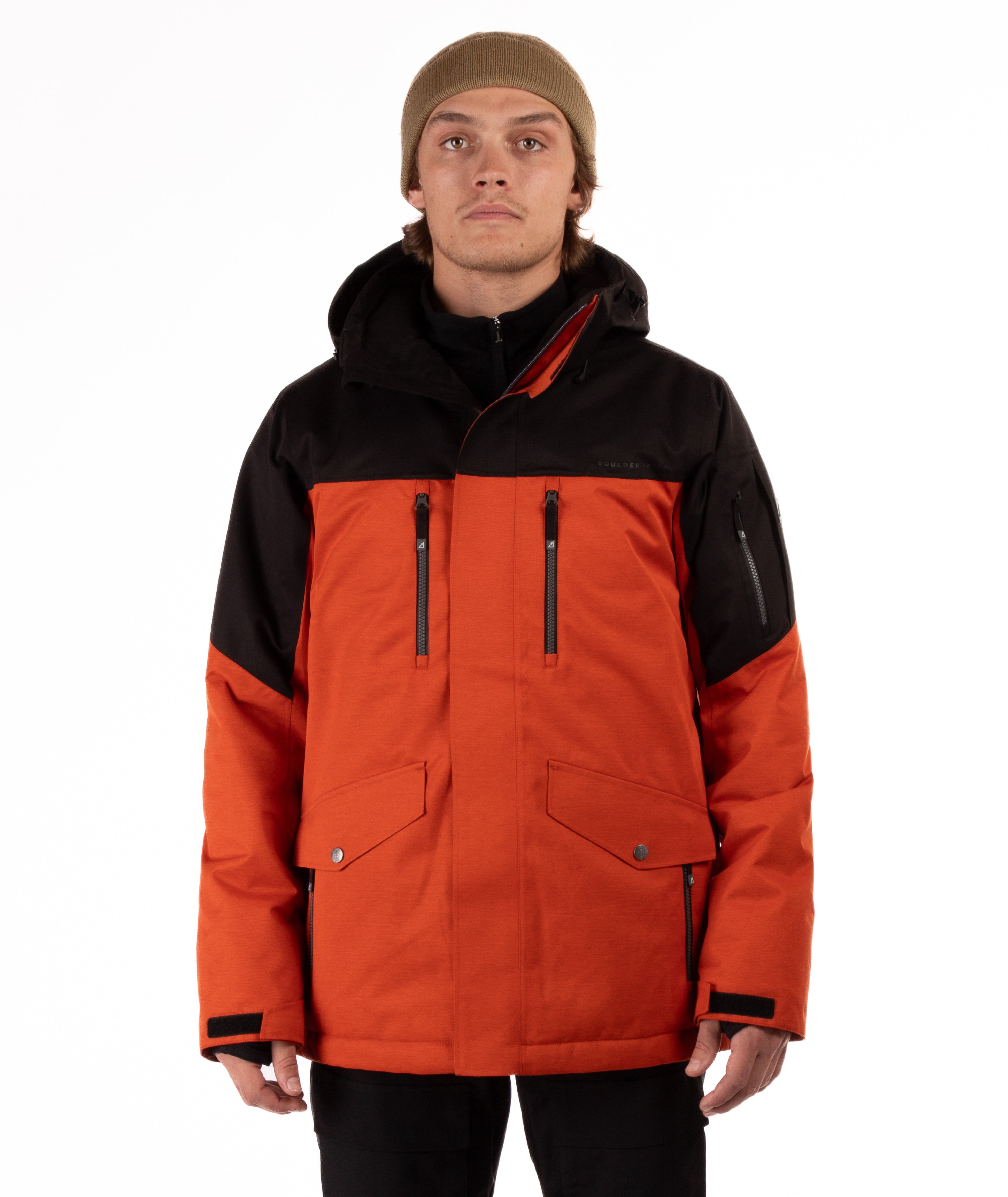 Person wearing a black and orange jacket on a white background