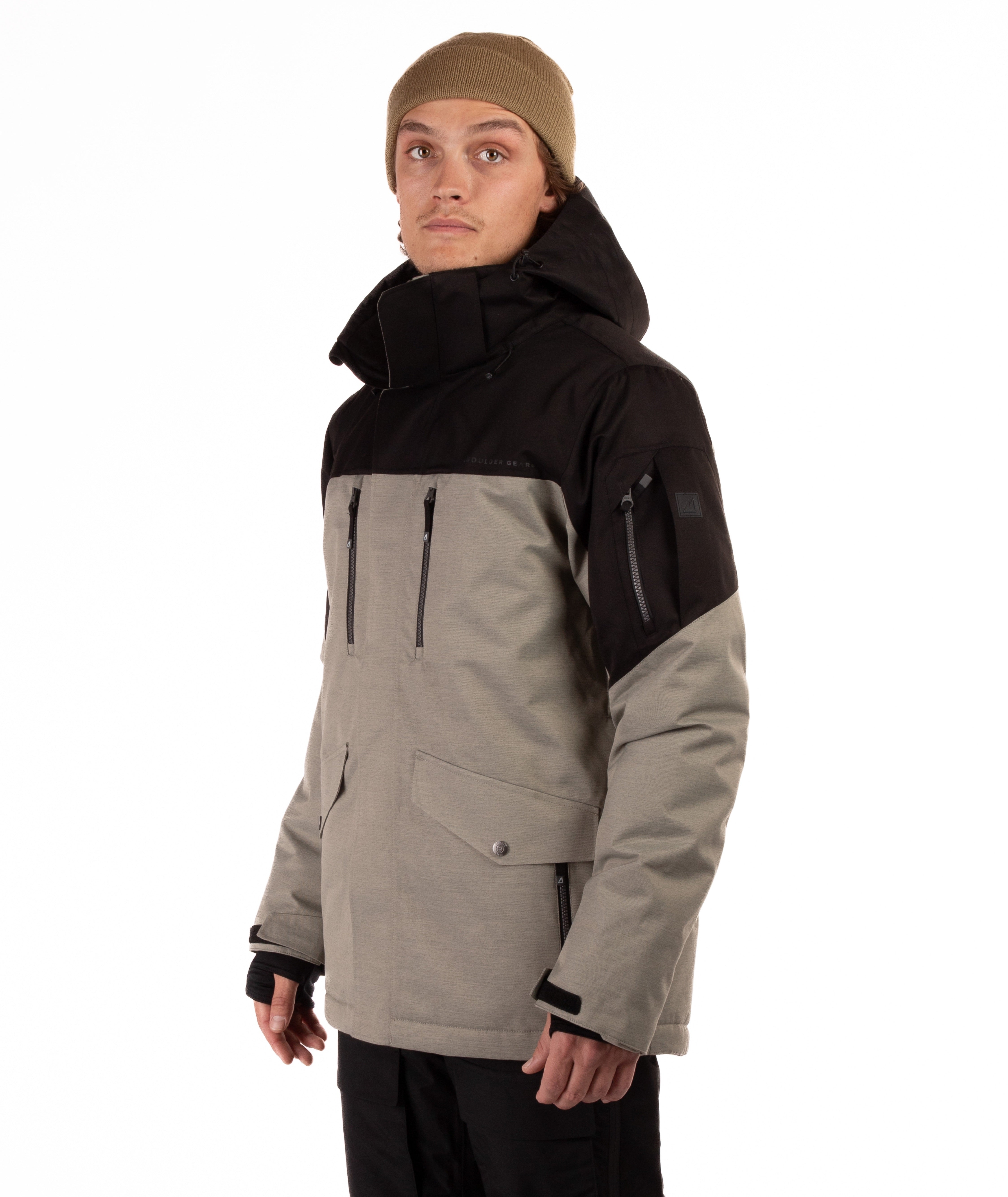 Person wearing a black and gray jacket on a white background