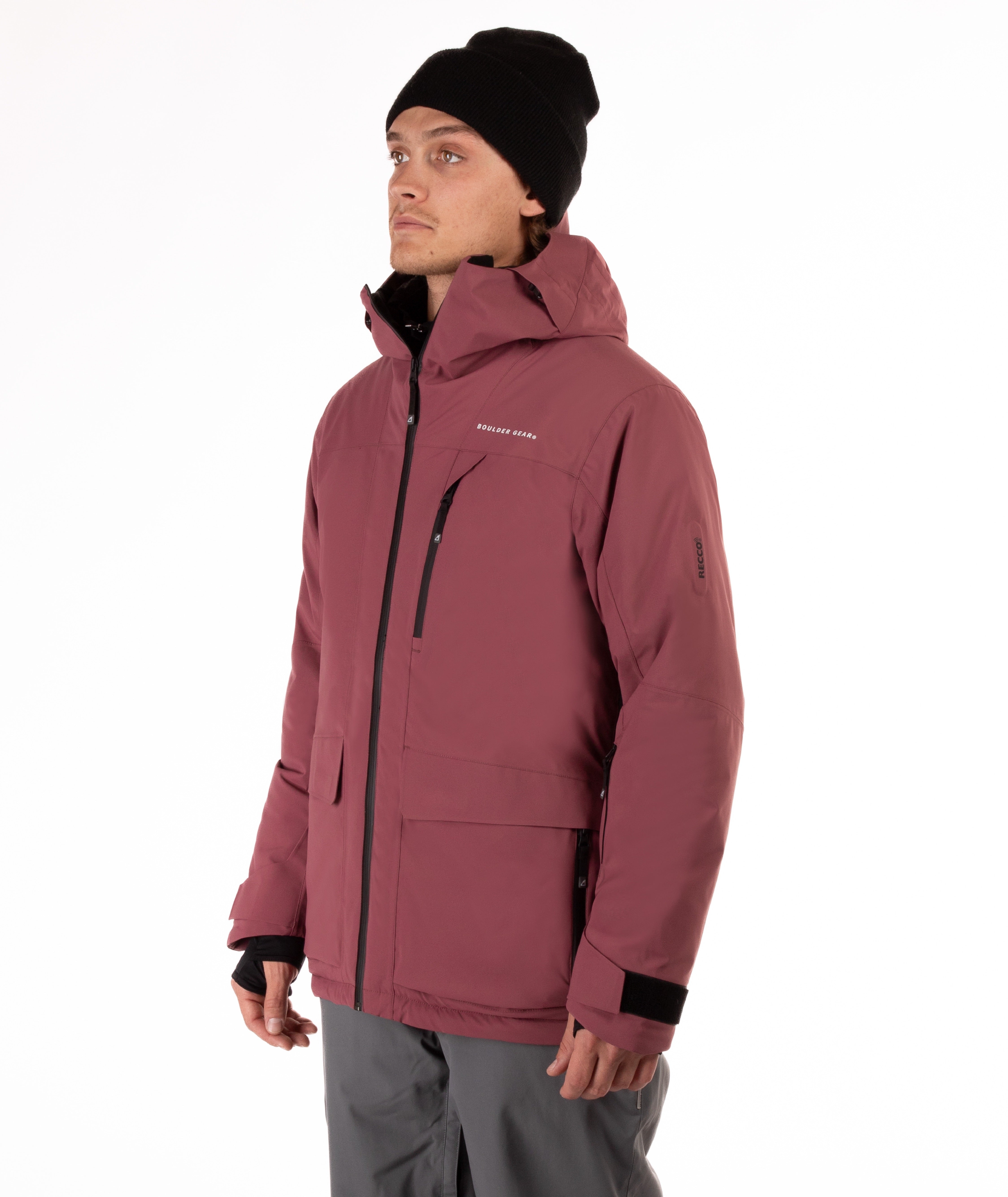 Person wearing a maroon jacket with black zippers and a brand logo on a white background