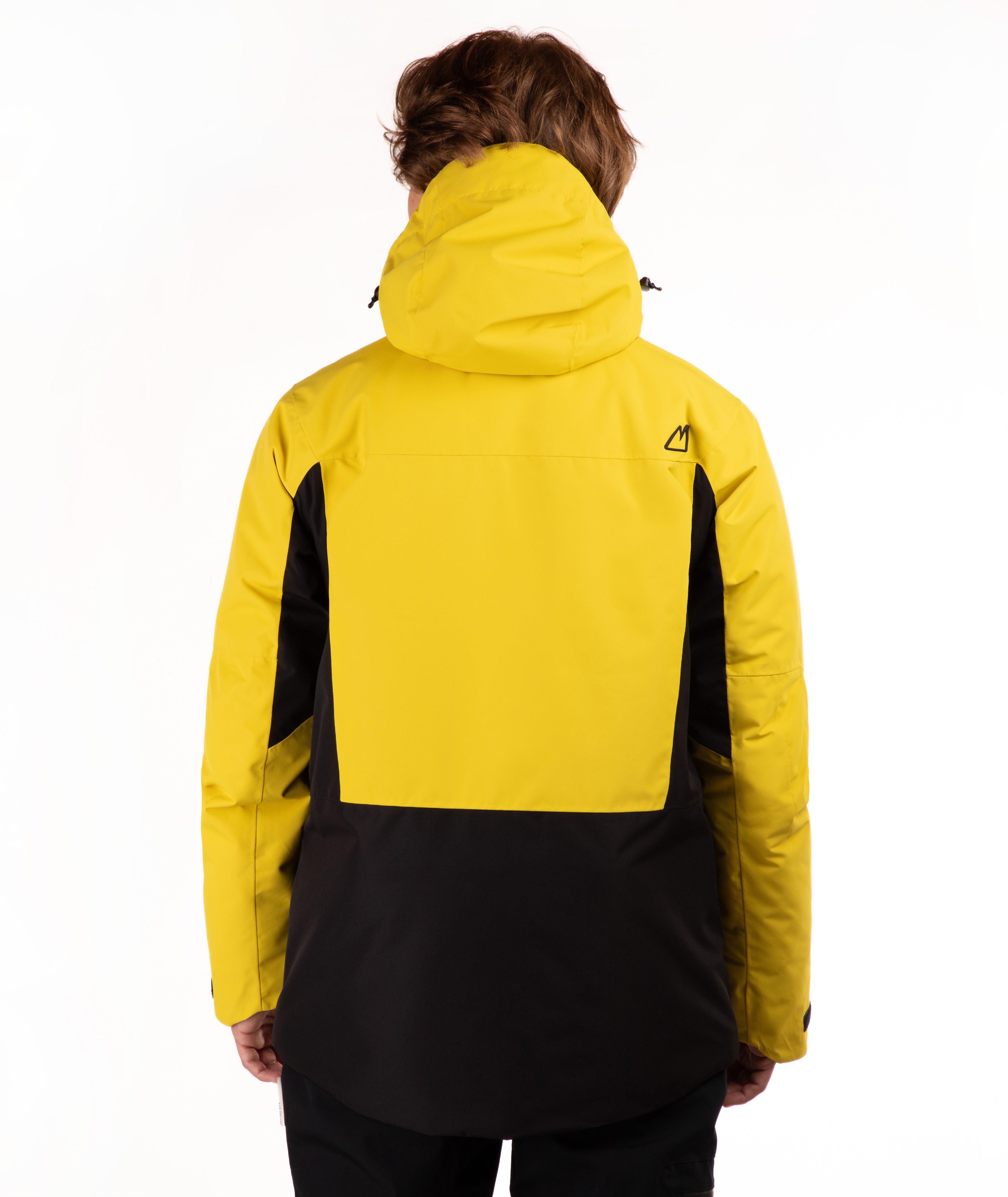 A person shown from the back wearing a hooded jacket with a bright yellow upper section and black lower section and side panels, photographed against a clean white studio background.