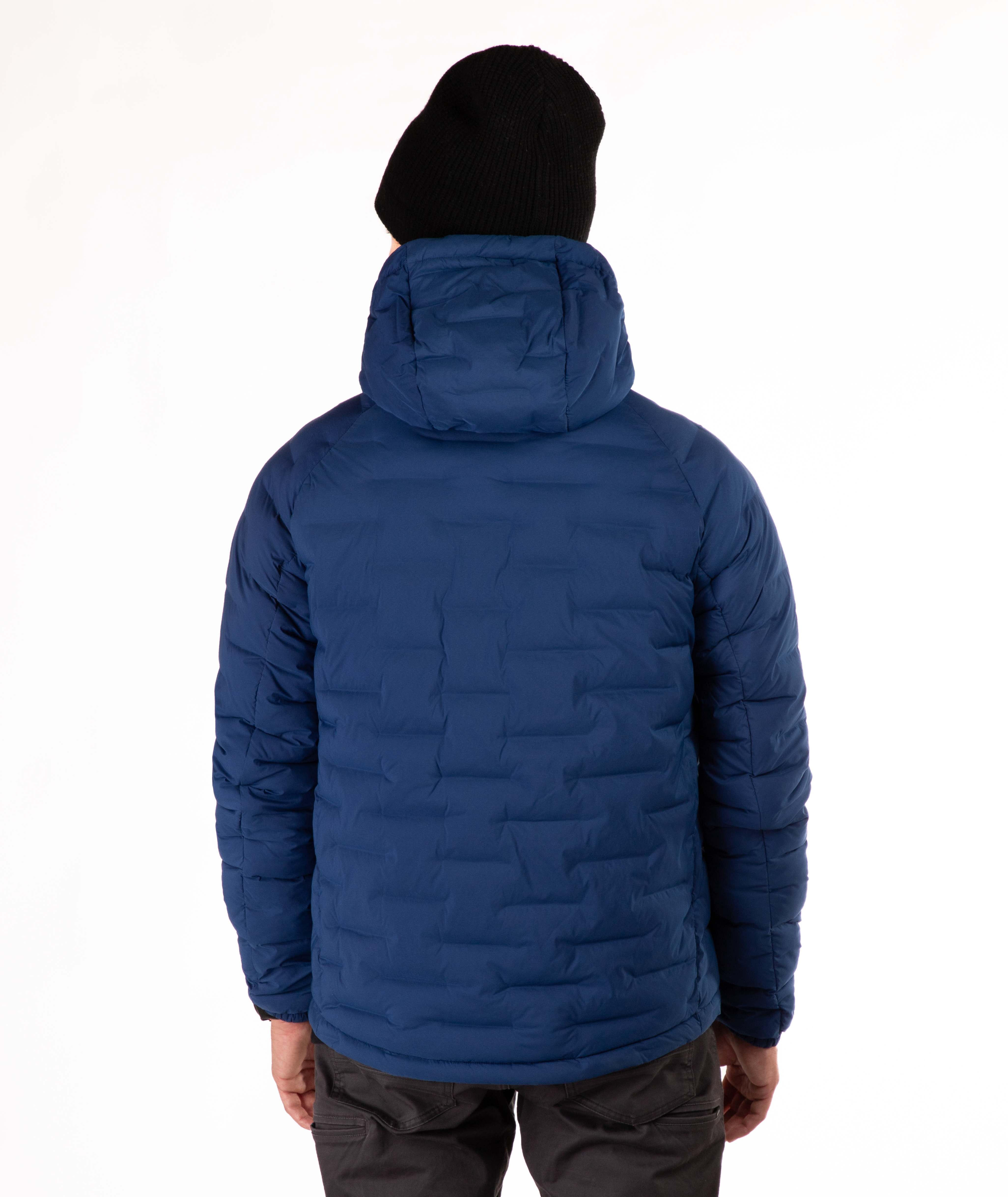 Person wearing a blue puffer jacket on a white background