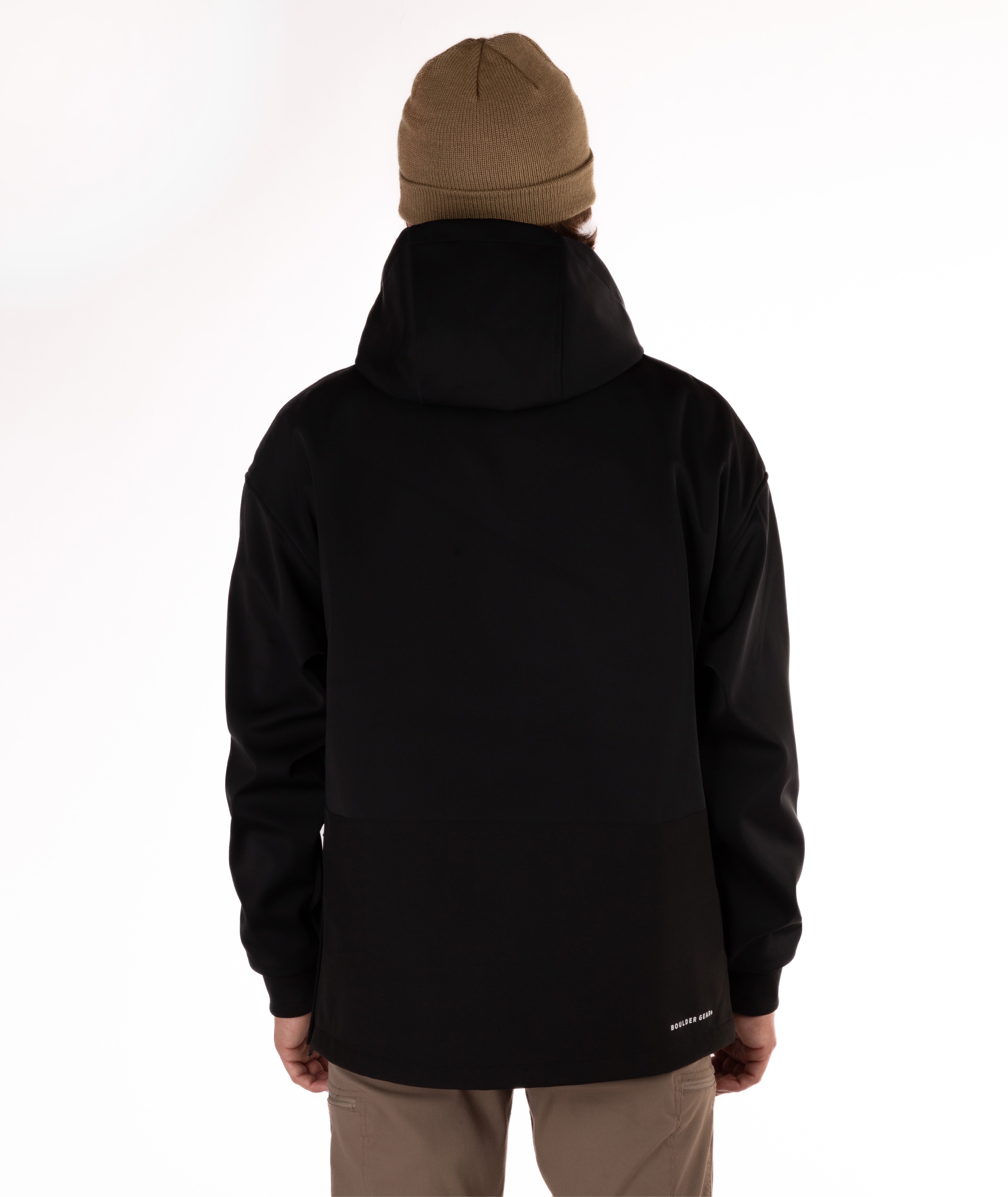 Person wearing a black softshell hoodie on a white background