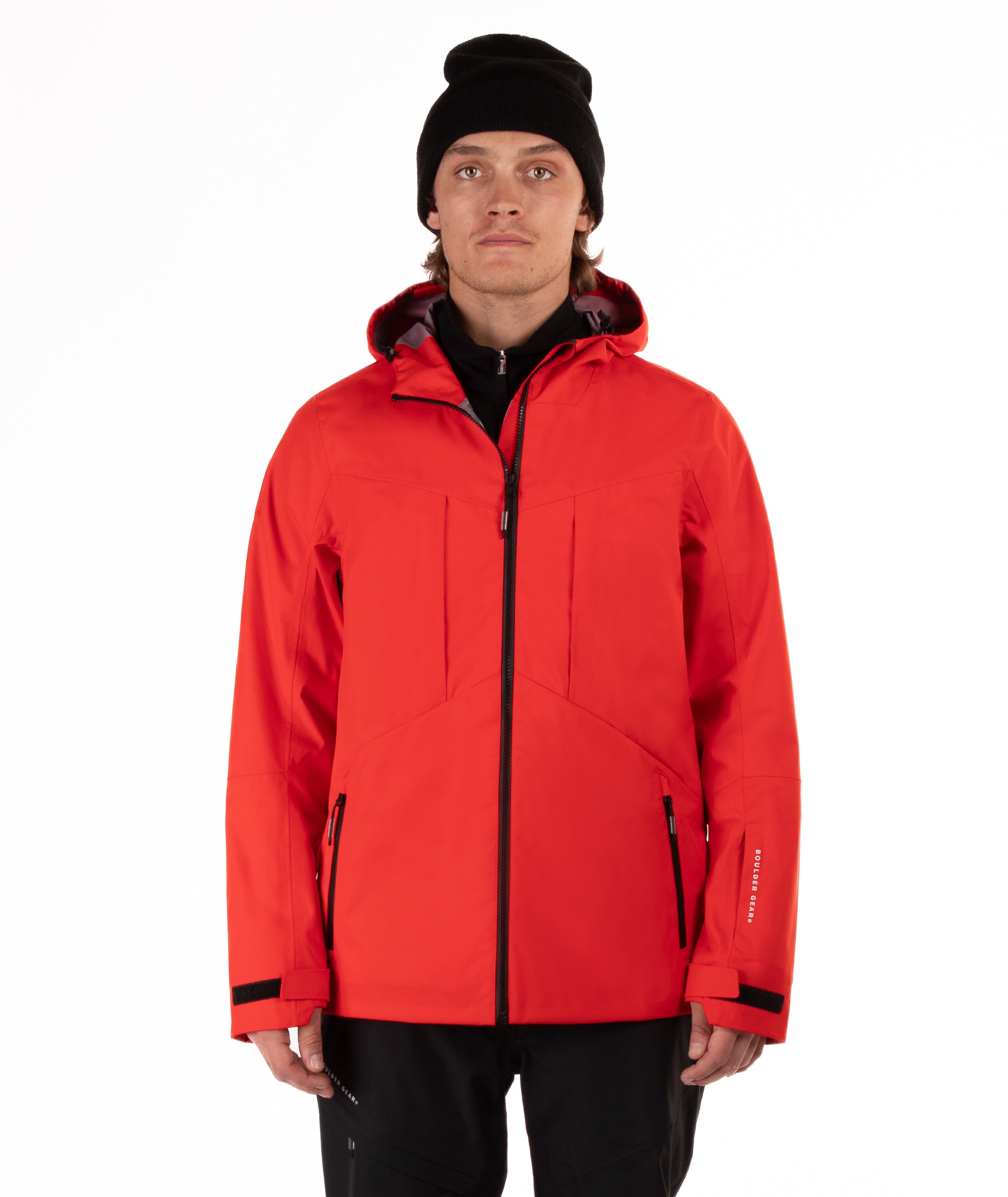 Person wearing a red jacket with black accents on a white background