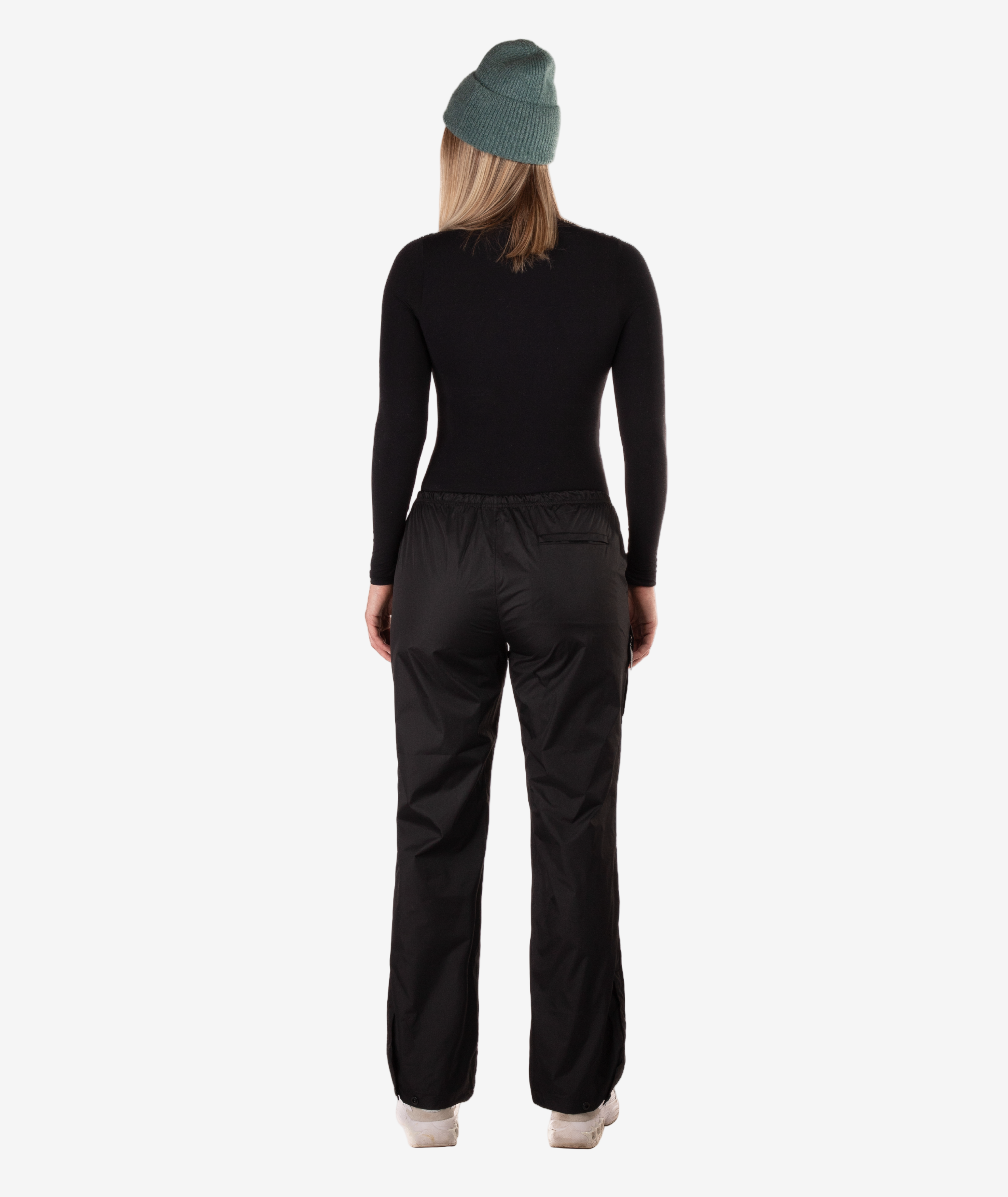 back of person wearing a black rain pants on a white background