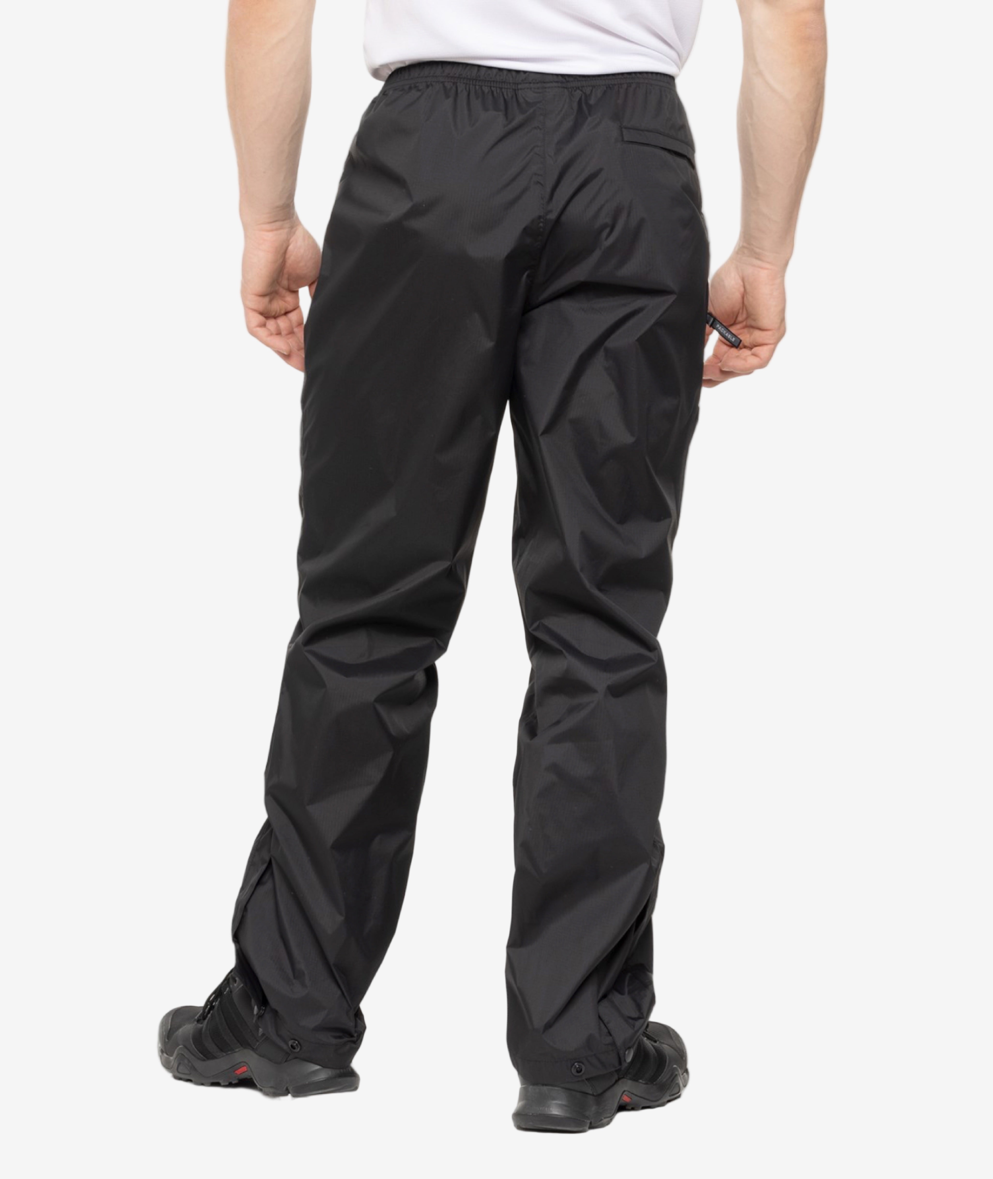 back of person wearing black pants on a white background