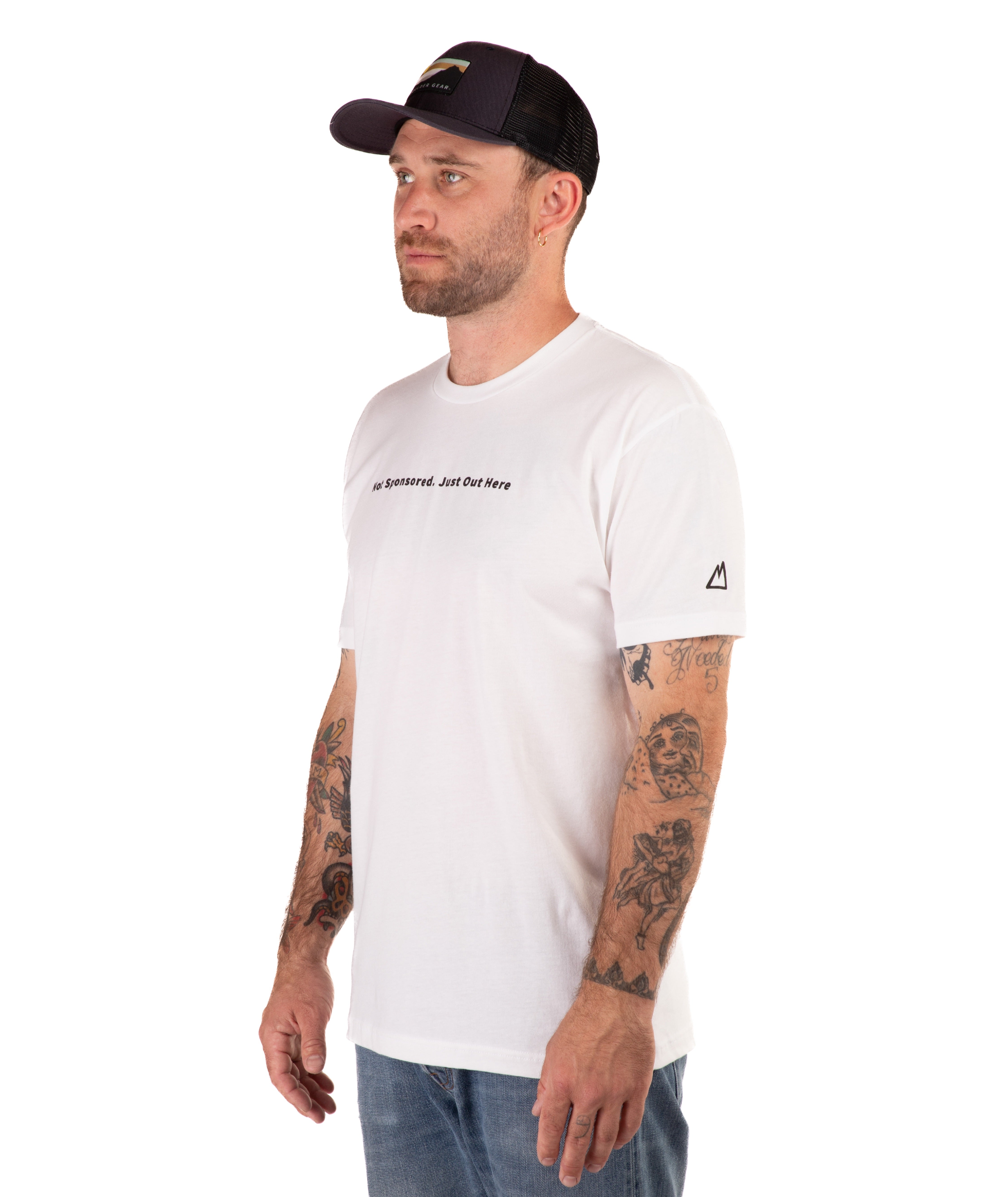 Man wearing a white t-shirt with text and a black cap on a white background