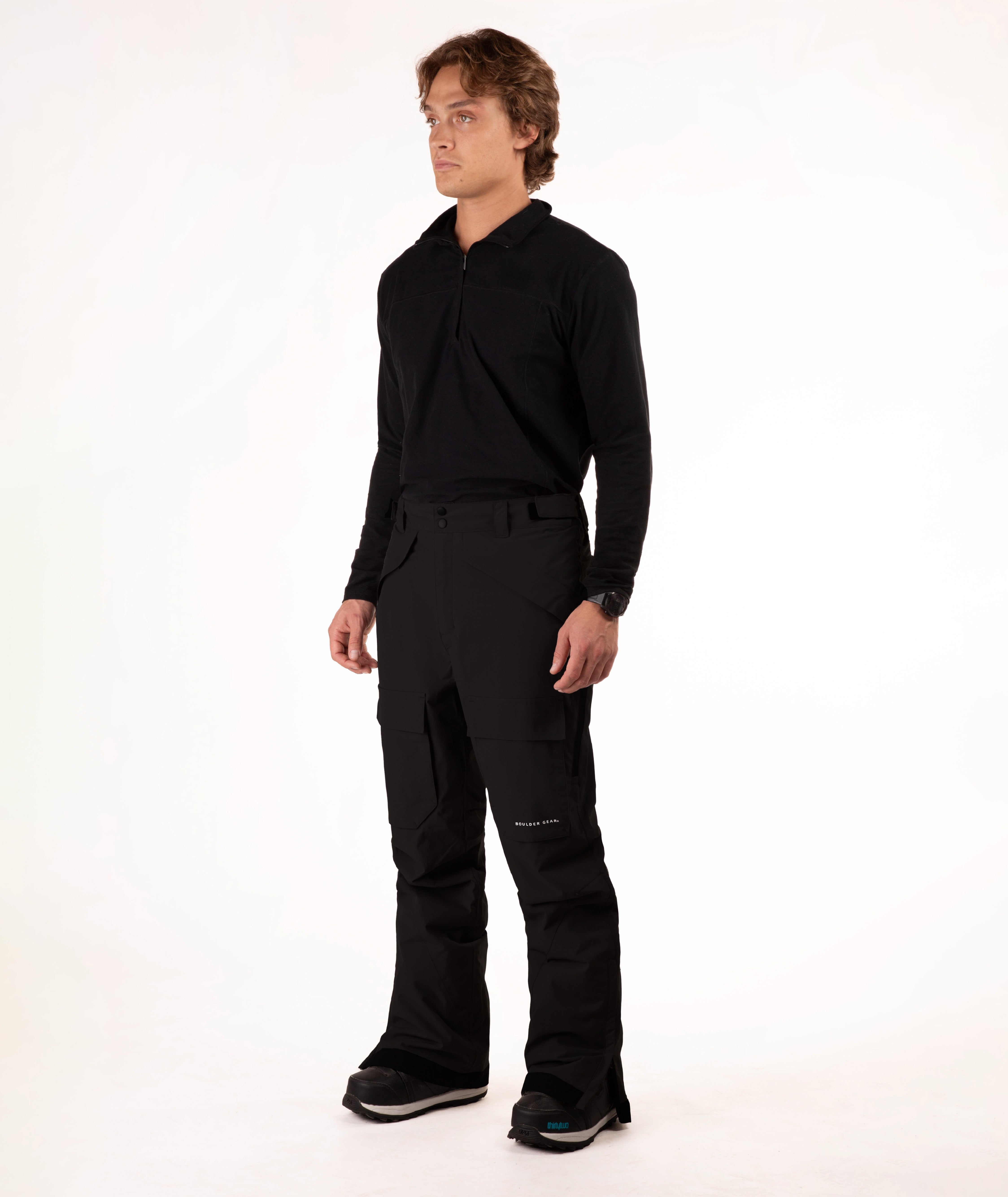 Man wearing a black outfit on a white background