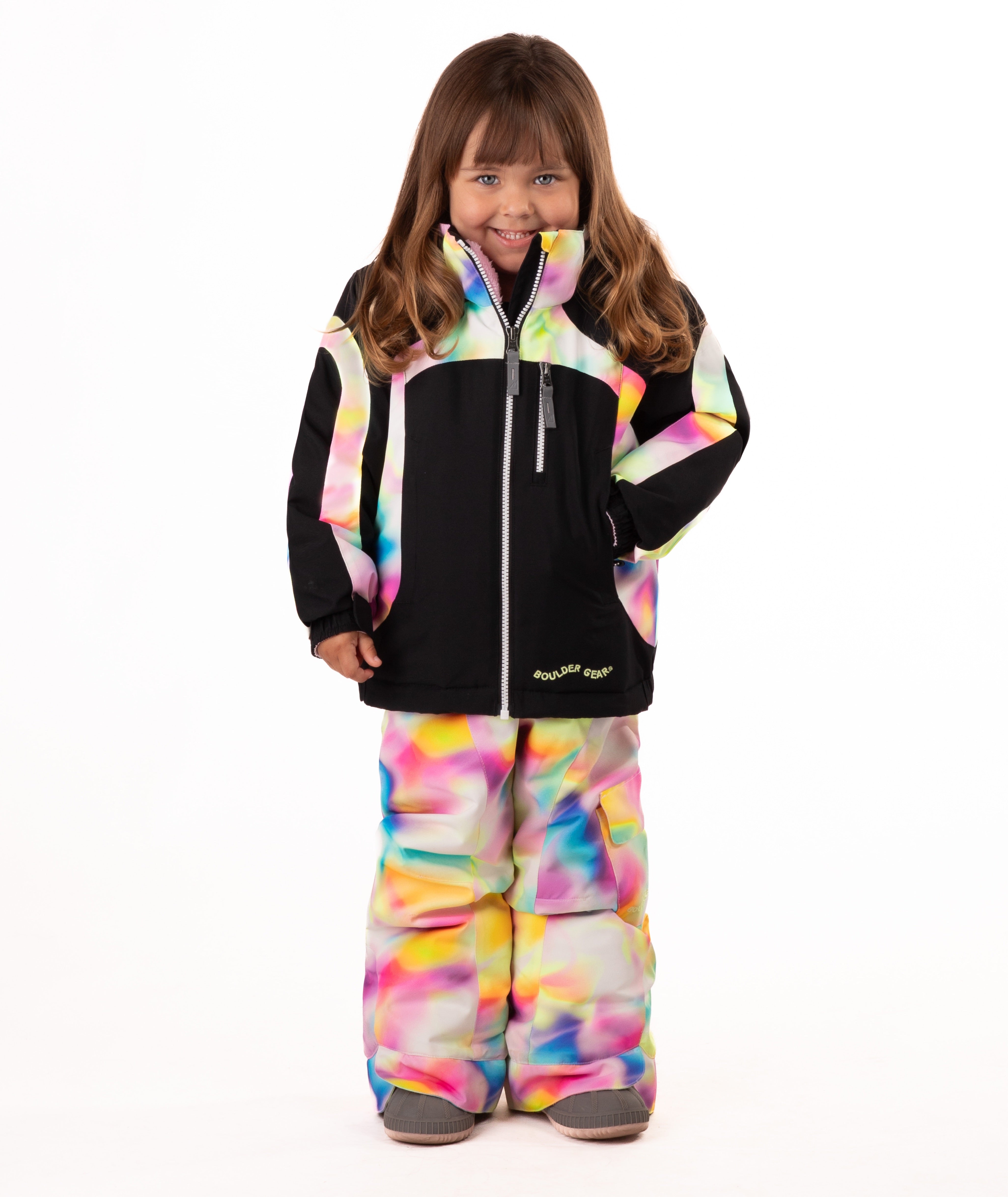 Child wearing a black winter jacket with pink, yellow, blue multi color trim on a white background