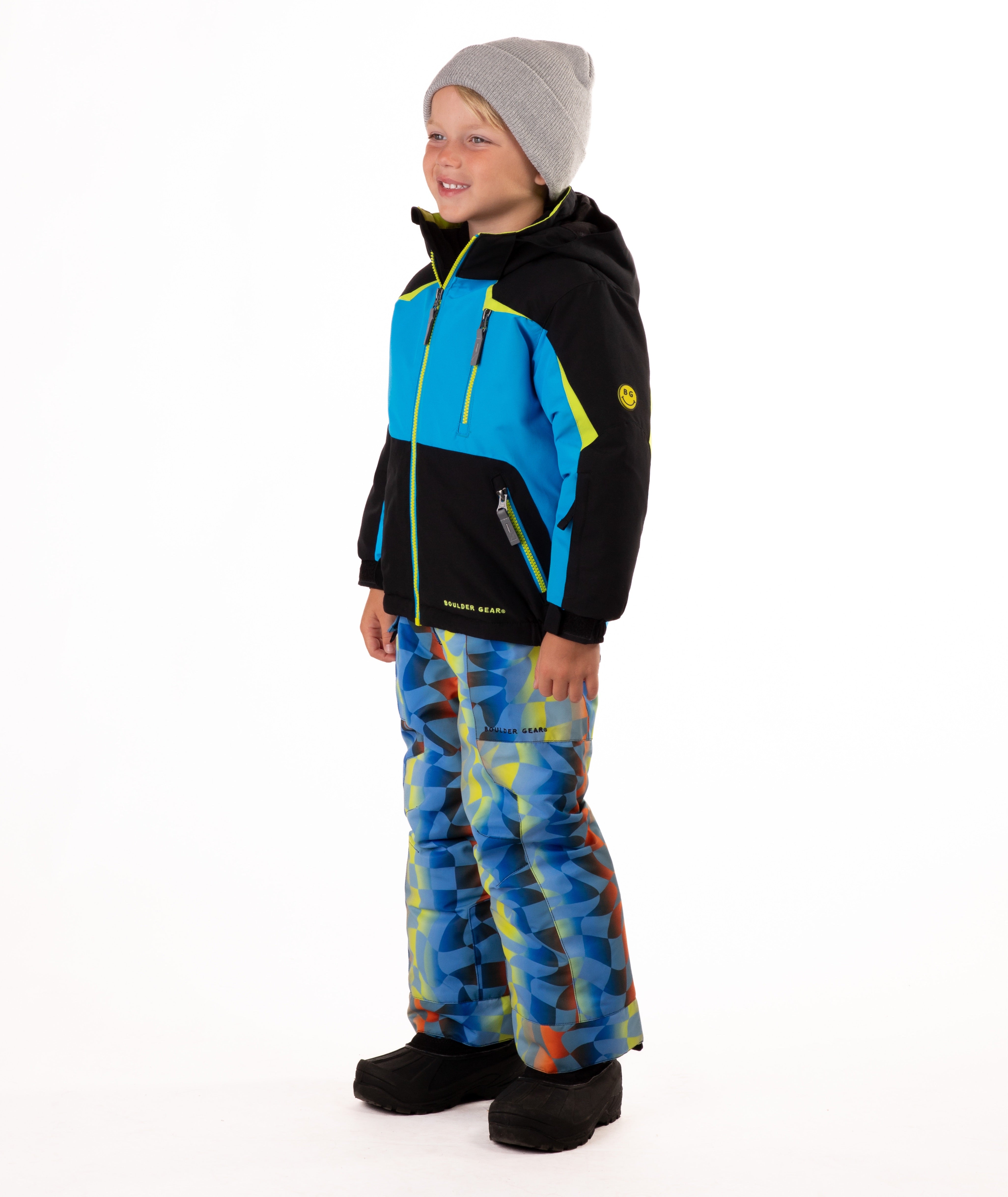 Child wearing an black and blue insulated winter jacket with bright lime trim and a bright lime center front zipper
