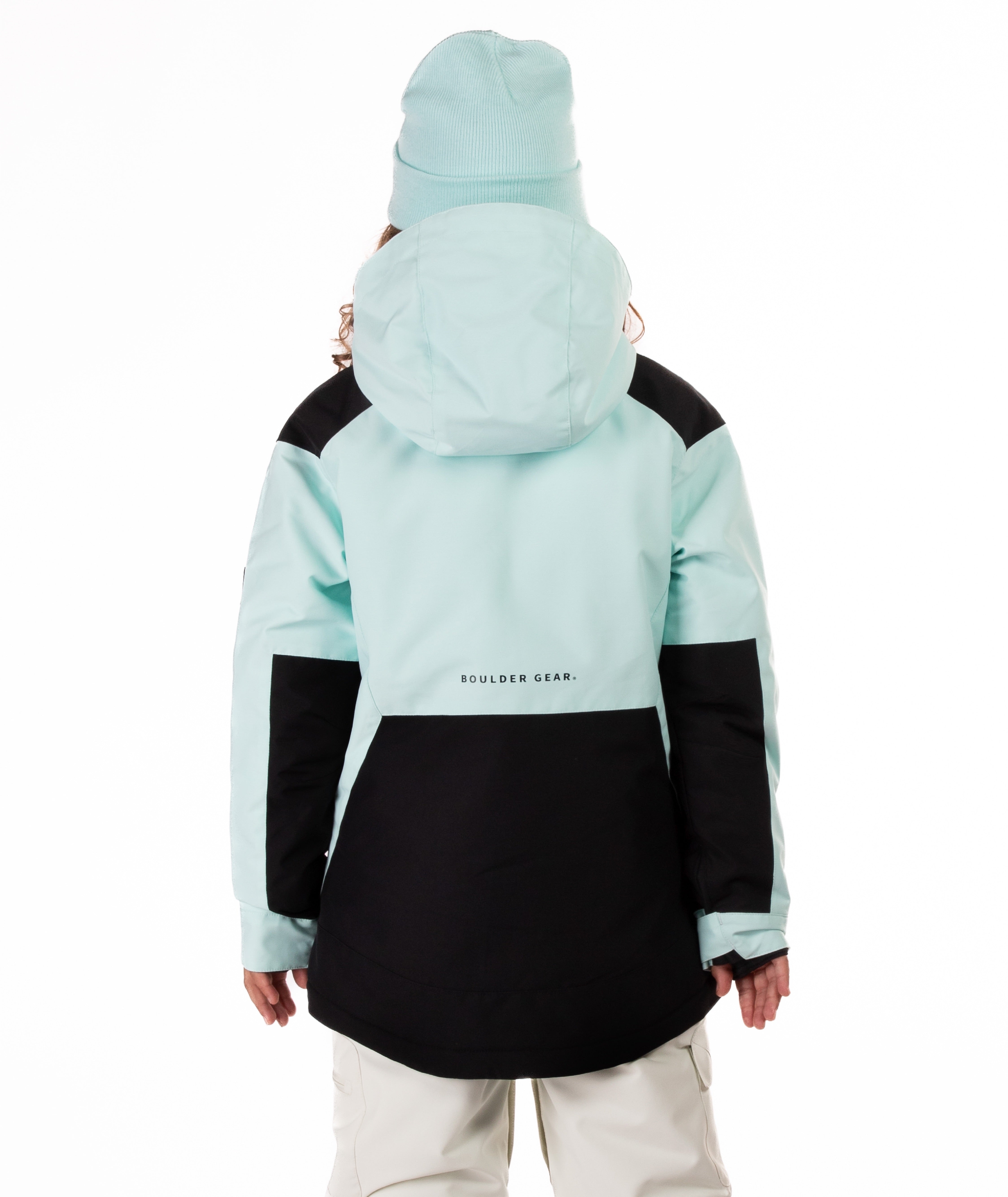 Youth Girl wearing a light blue and black jacket highlighting Boulder Gear brand label on a white background