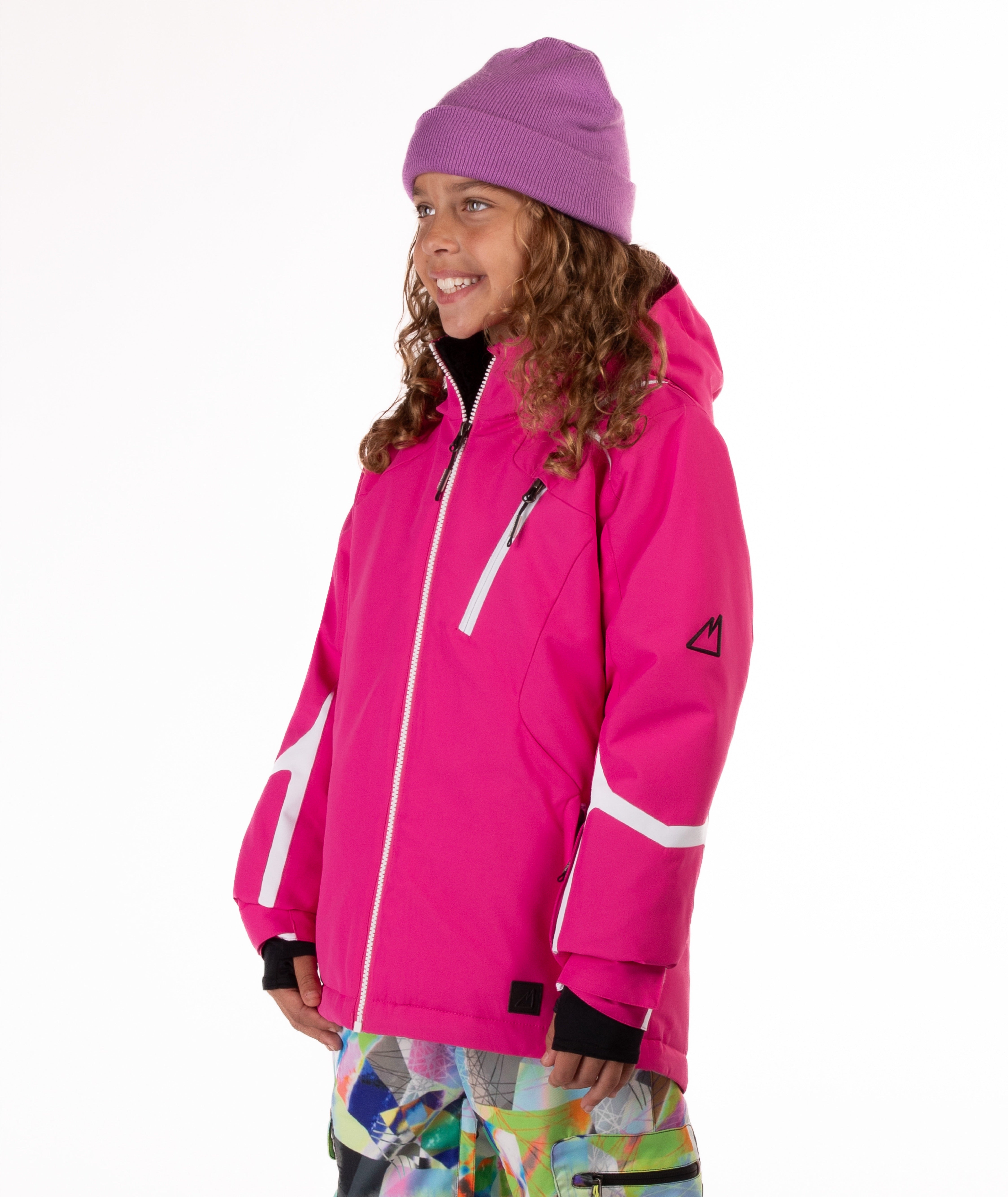 Youth girl wearing a bright pink ski jacket with white accents on a white background