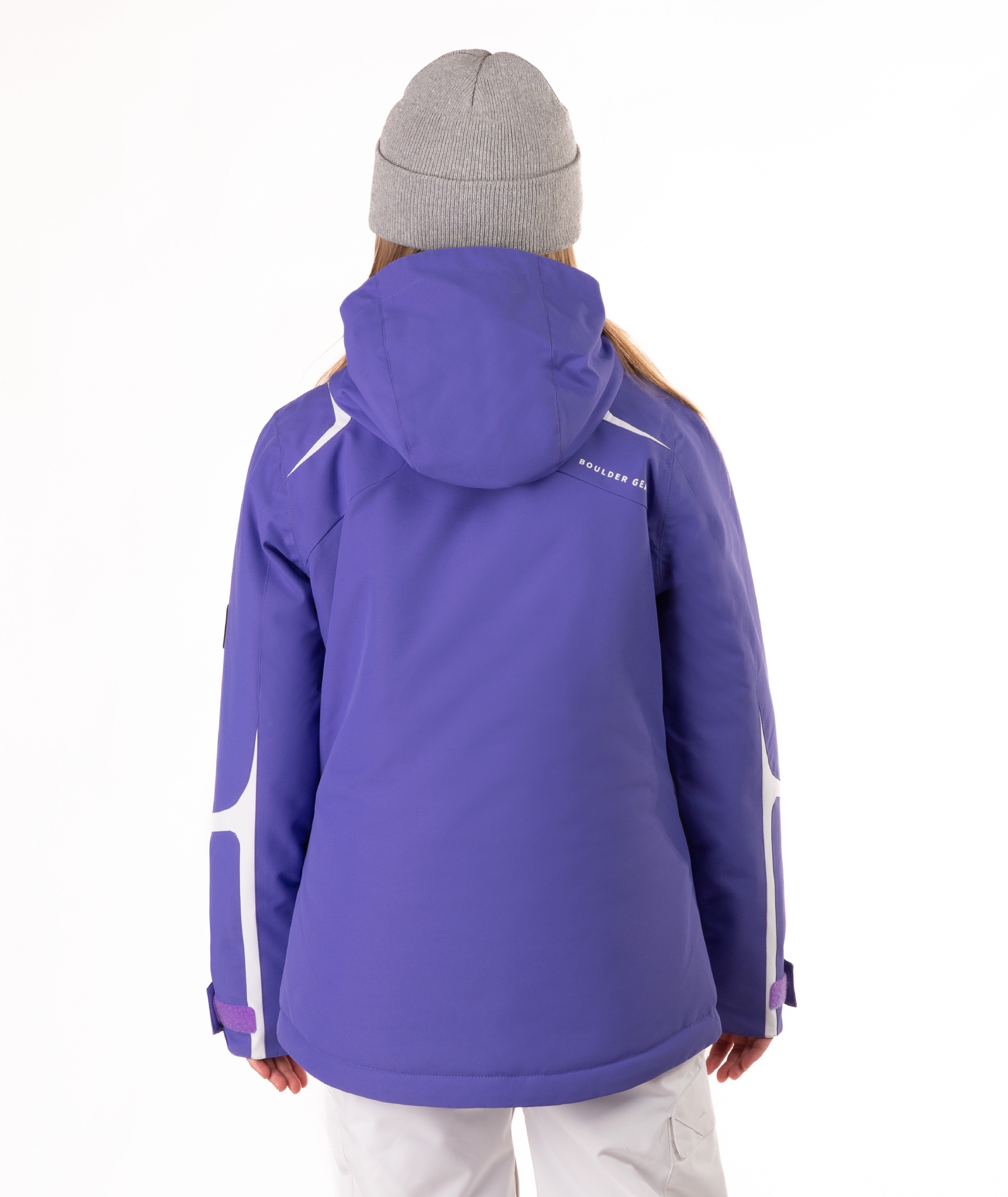 Youth girl wearing a purple jacket with white accents on a white background