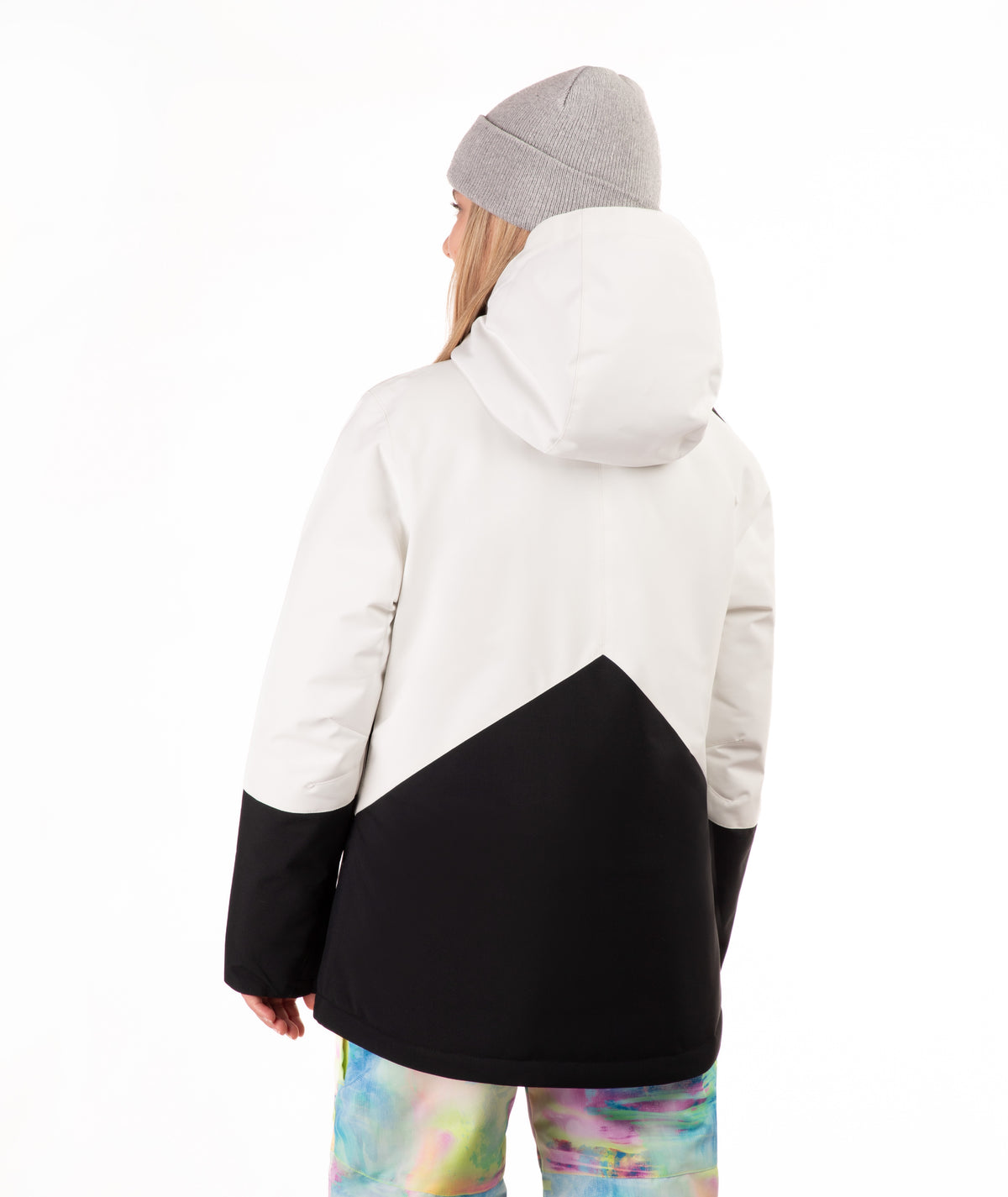 Person wearing a white and black jacket with a gray beanie on a white background