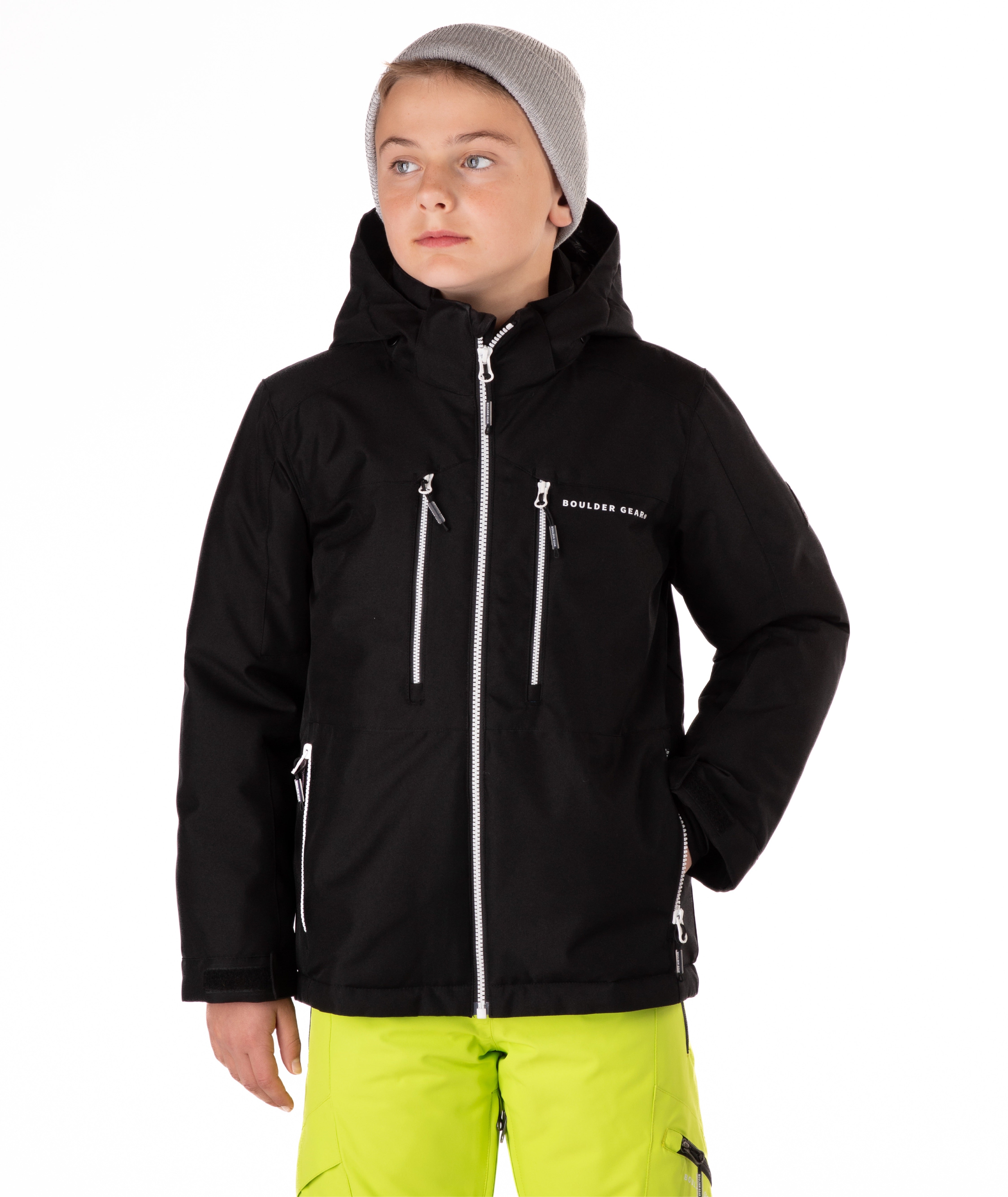 Youth boy wearing a black jacket with white zippers and a Boulder Gear brand logo on a white background