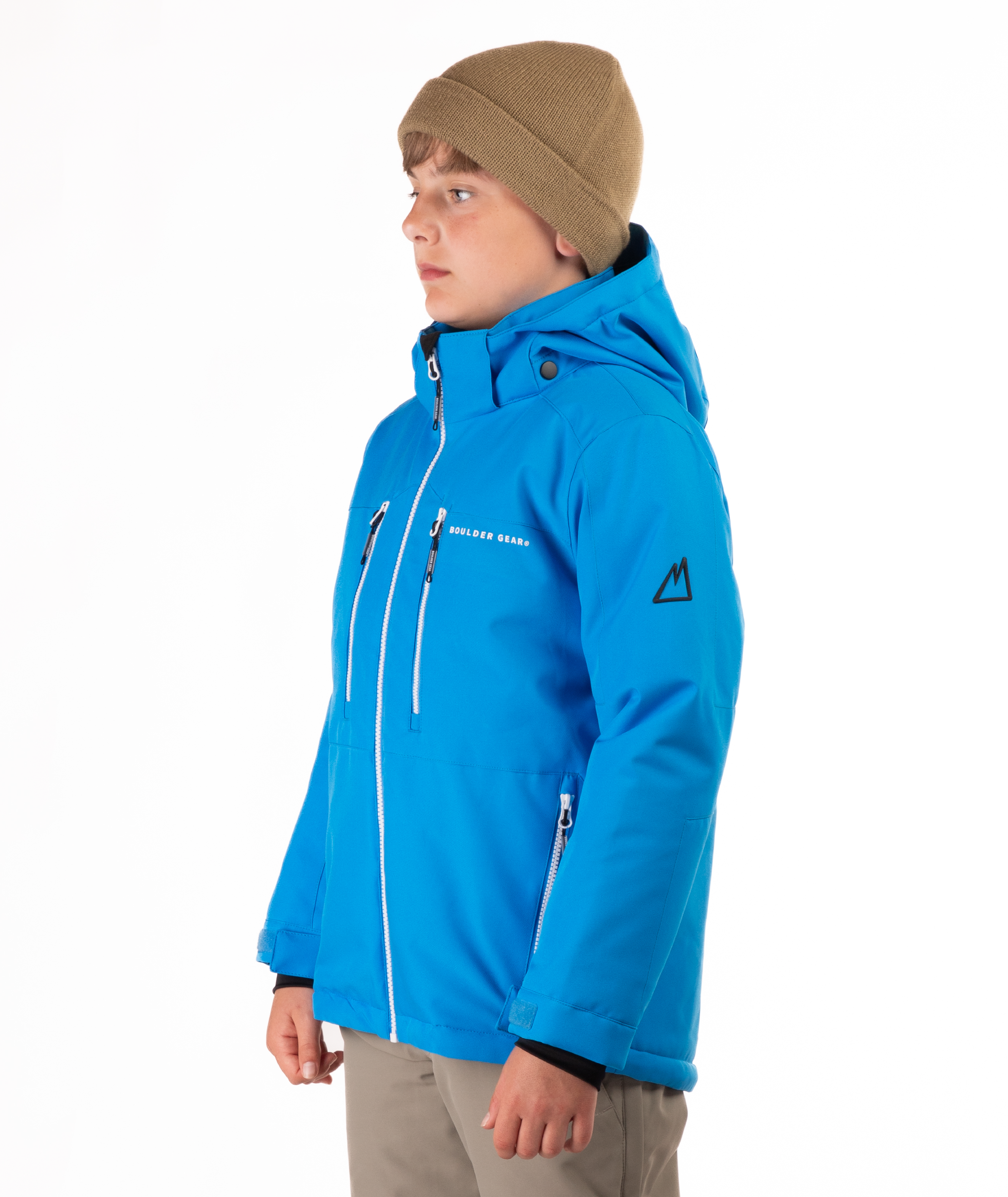 Youth boy wearing a blue jacket with white zippers and a Boulder Gear brand logo on a white background