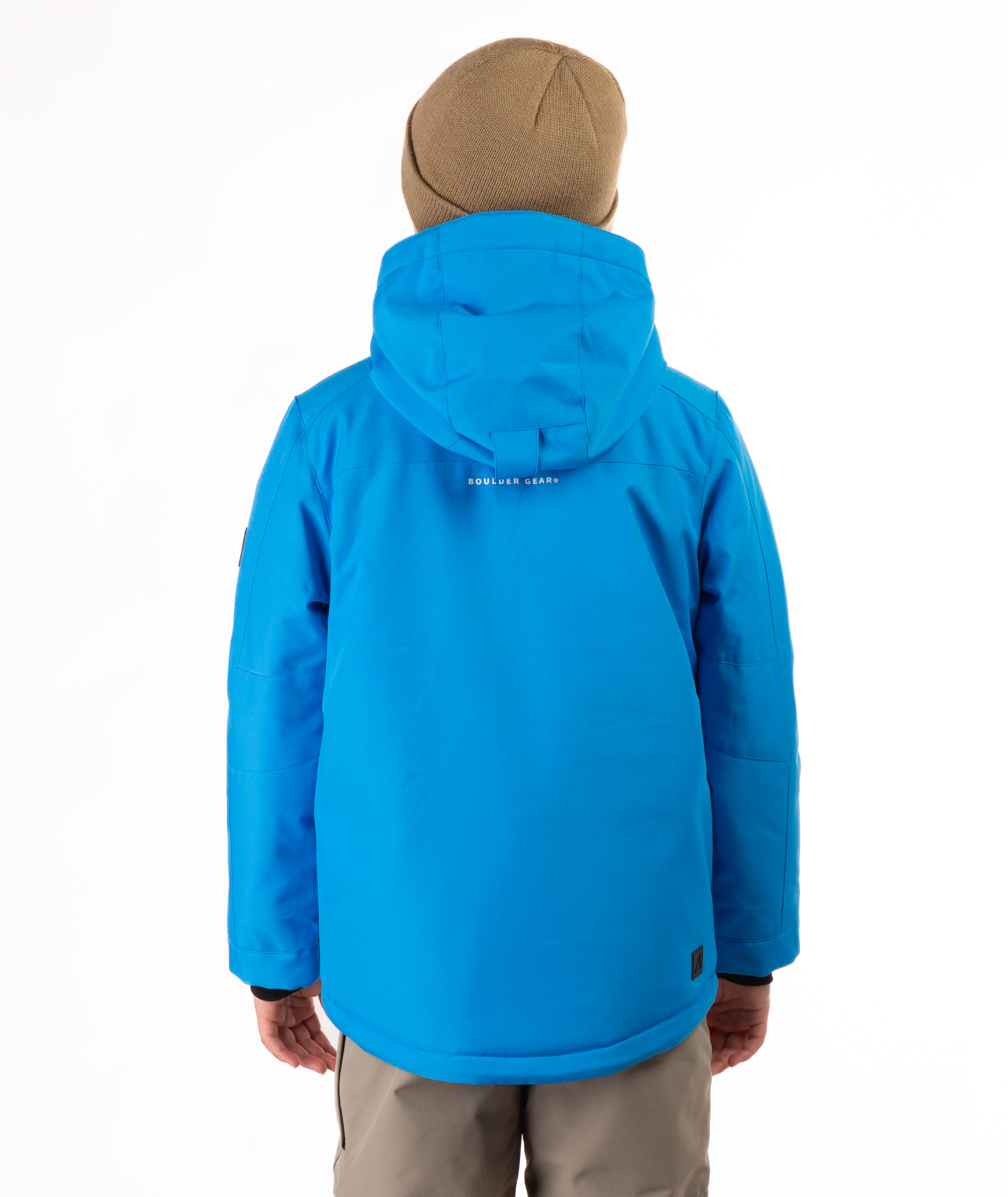 Youth Boy wearing a blue jacket with a visible brand logo on the back, standing against a white background.