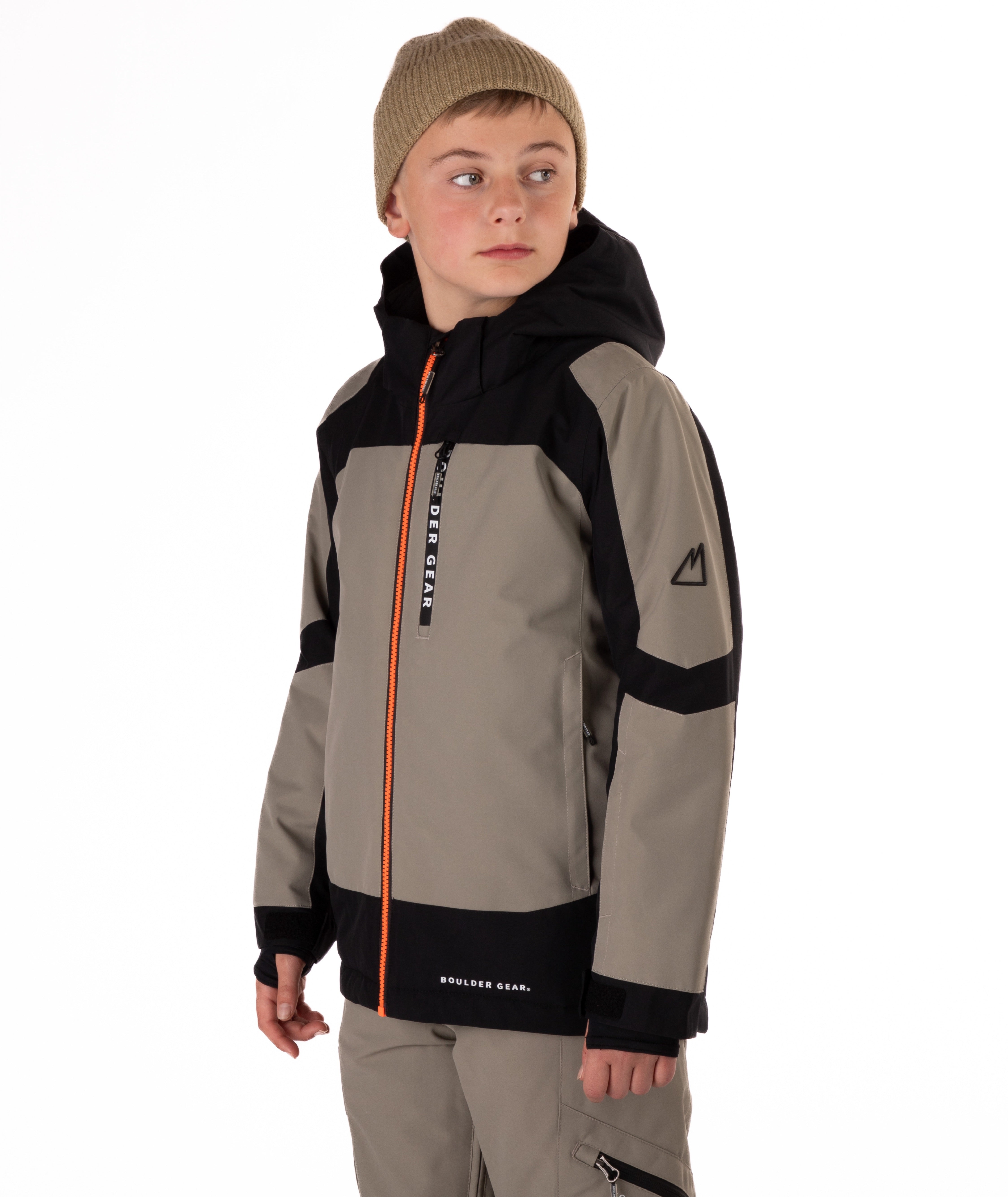 Child wearing a gray and black jacket with an orange zipper on a white background