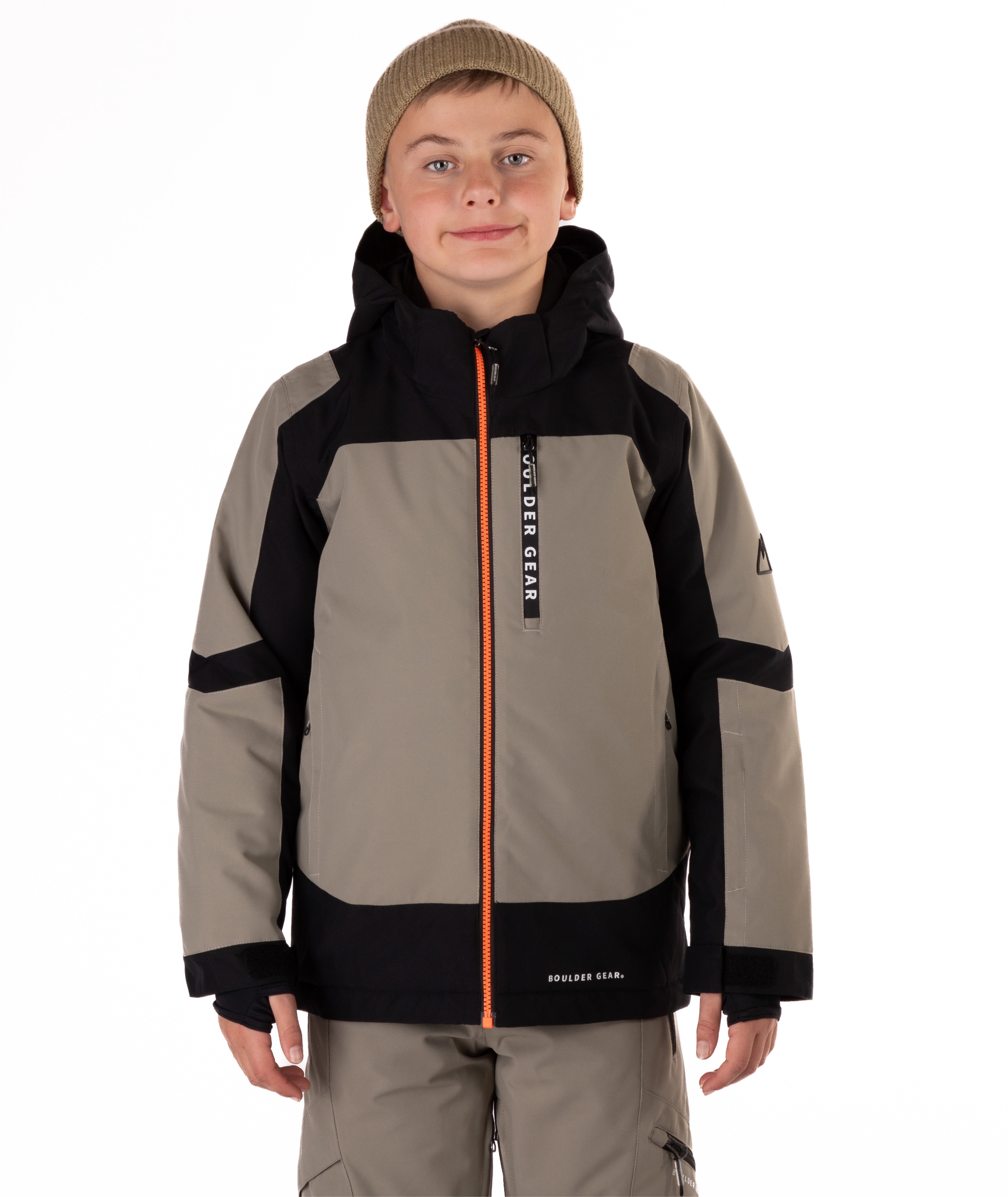 Child wearing a gray and black jacket with orange zipper on a white background