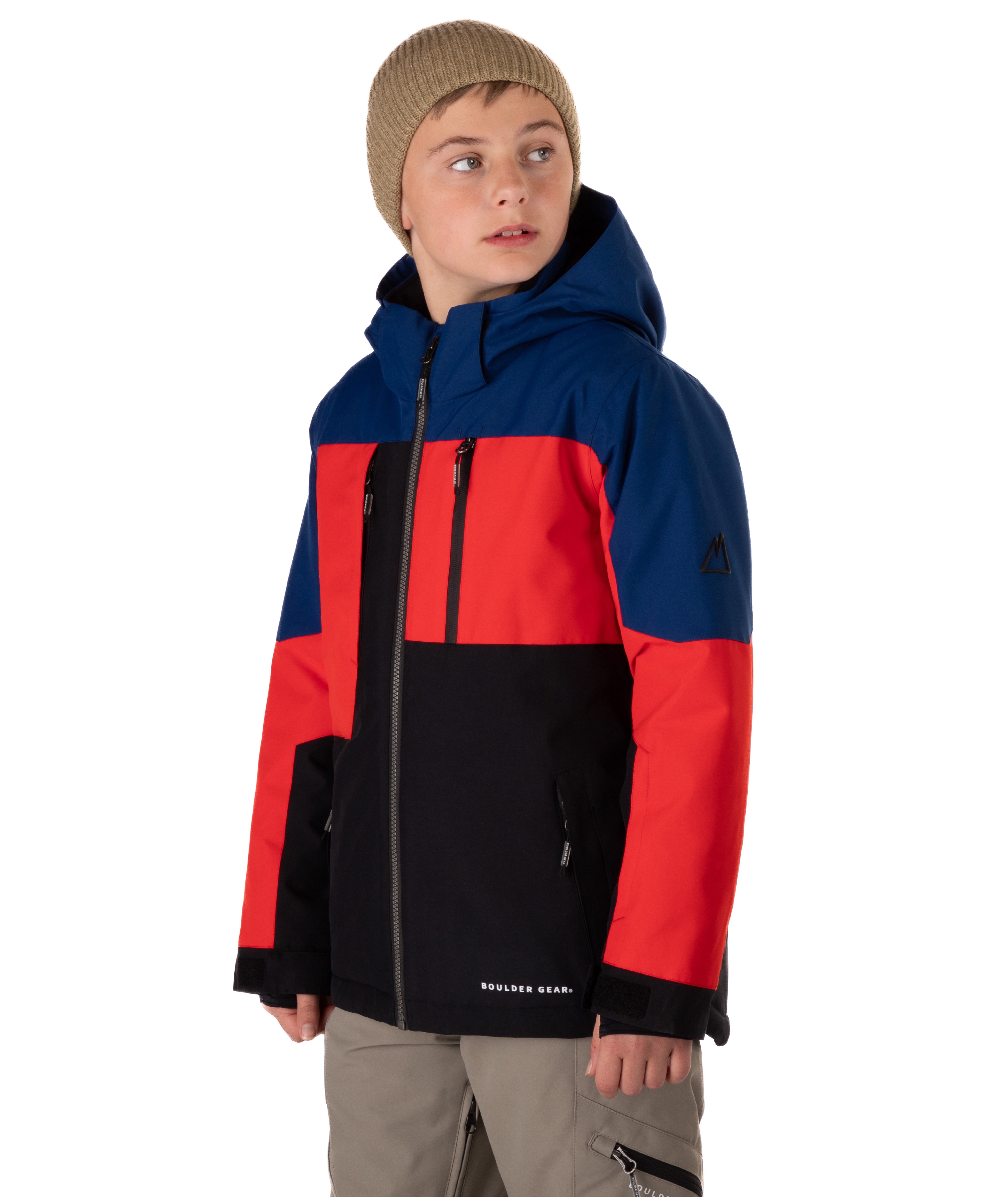 Boy wearing a colorful jacket with black, blue, and red sections on a white background