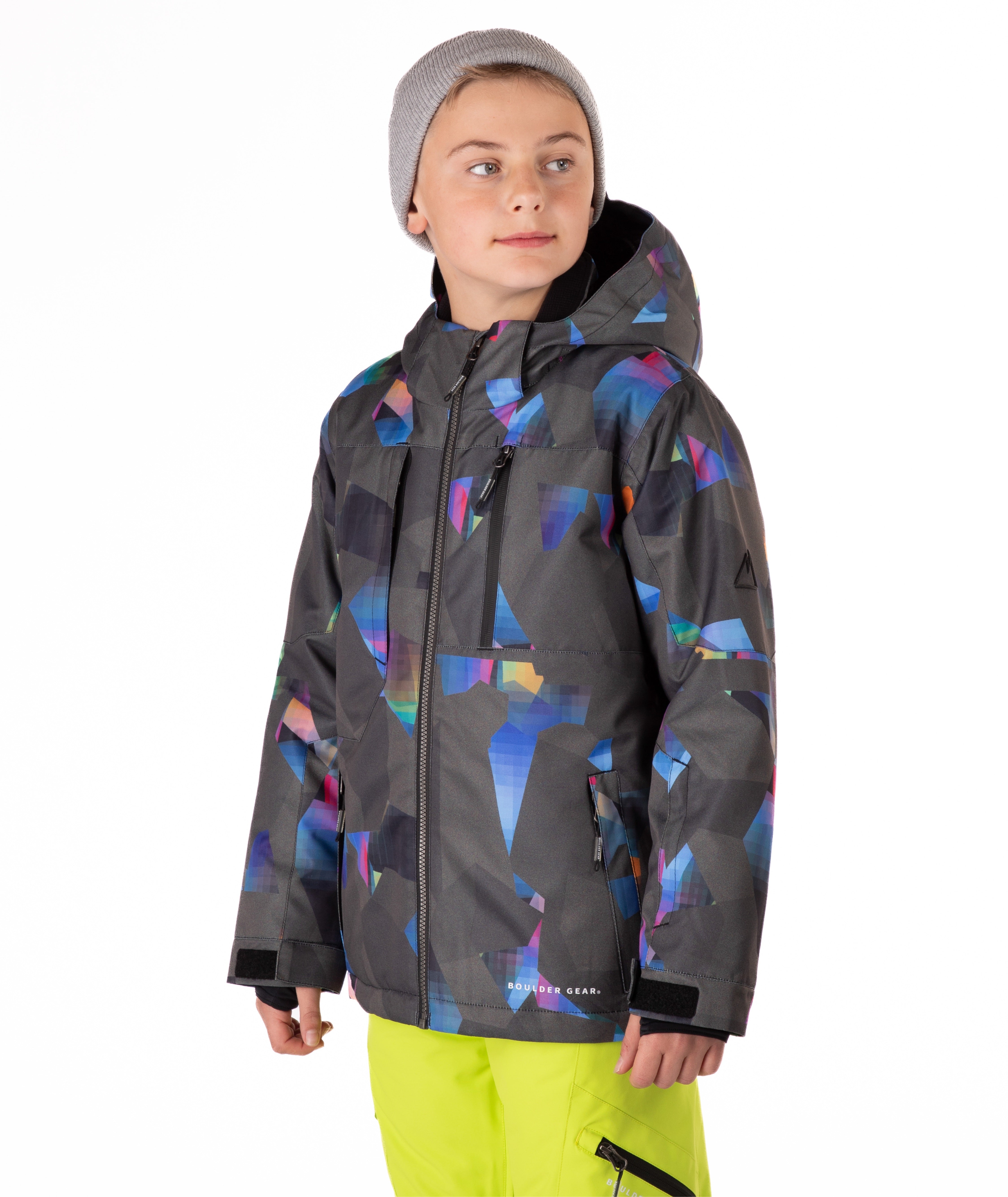 Youth boy wearing a colorful jacket with abstract patterns on a white background