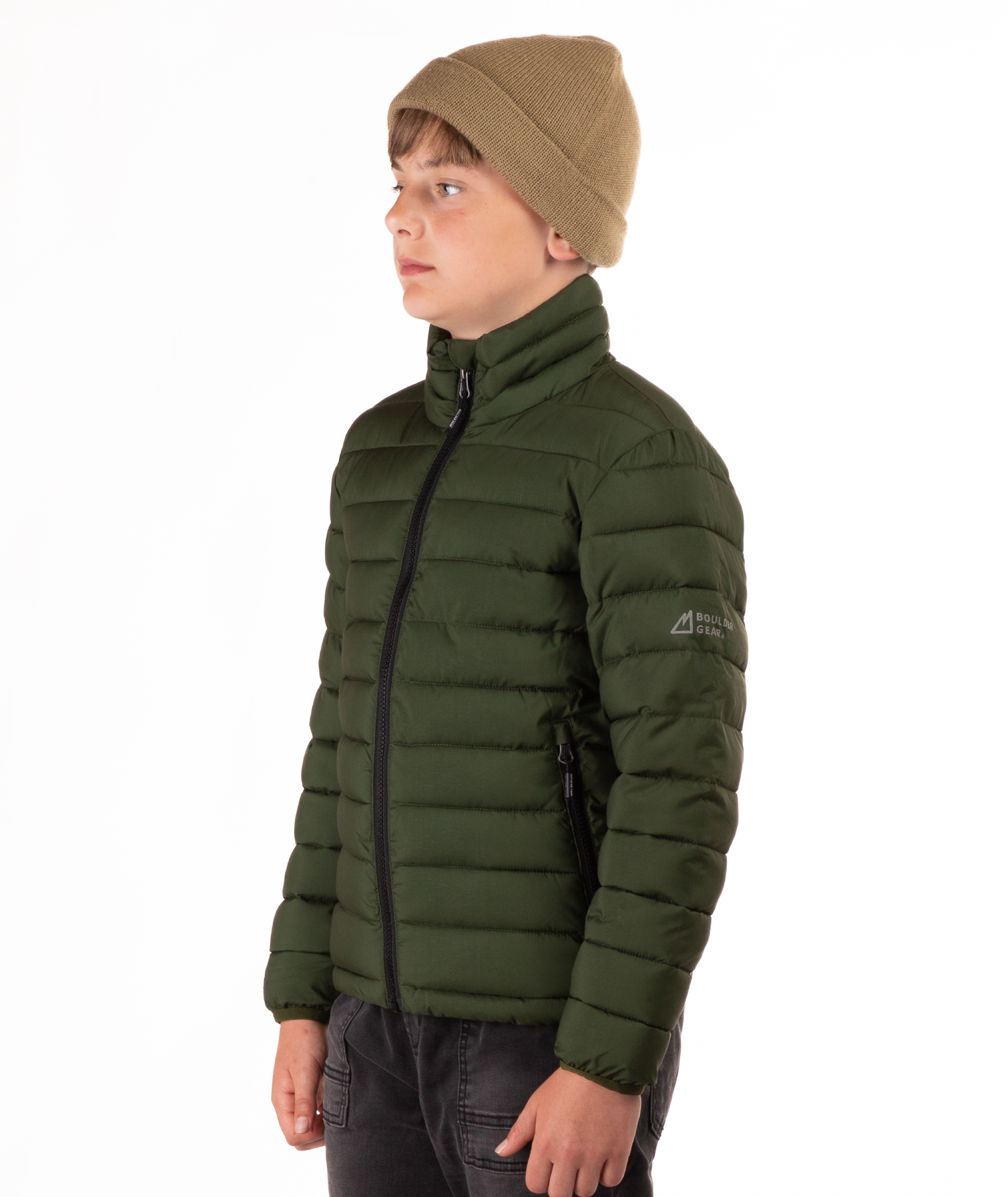 youth boy wearing a green puffer jacket on a white background
