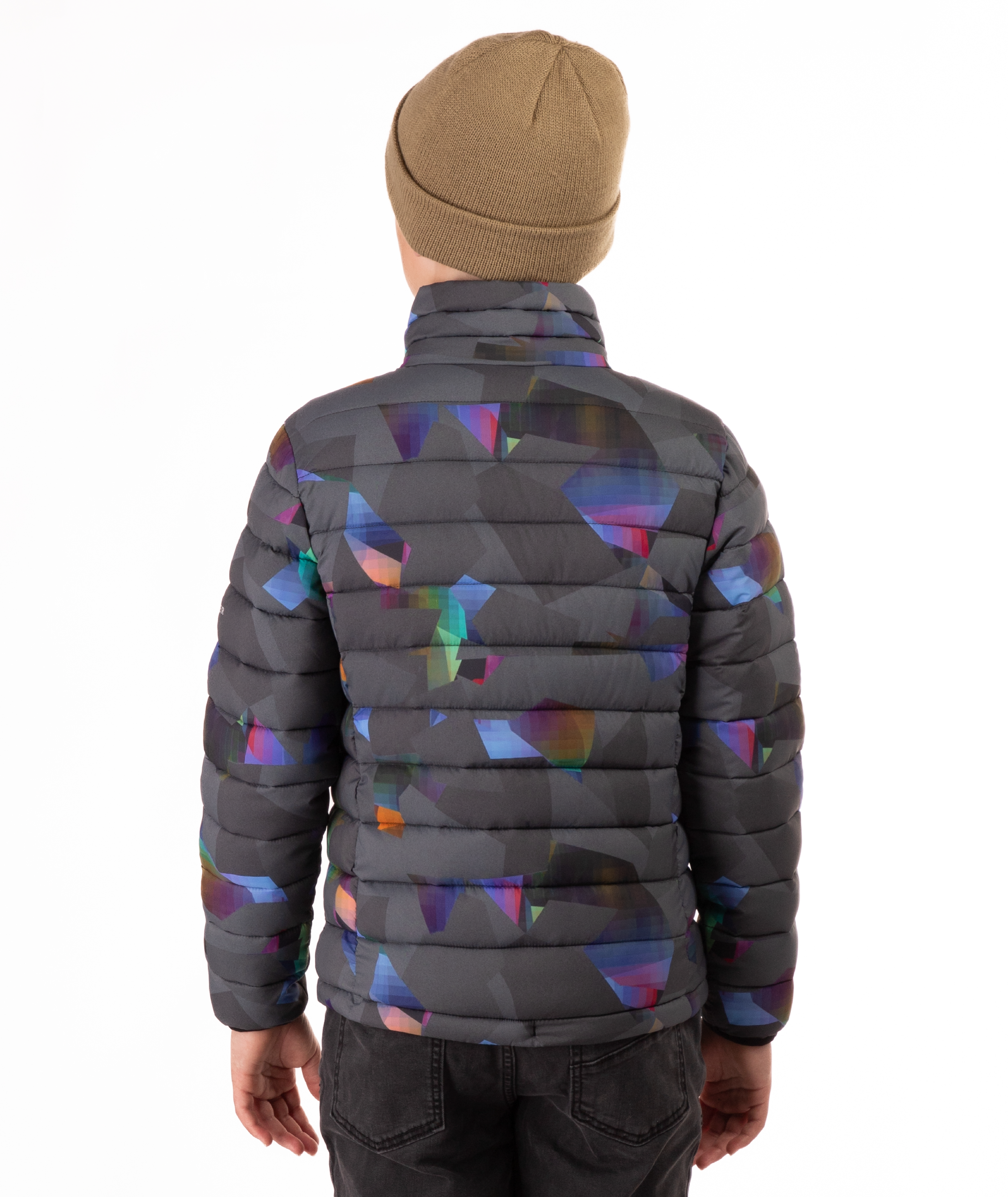 back of youth boy wearing a multi colored abstract patterned puffer jacket on a white background
