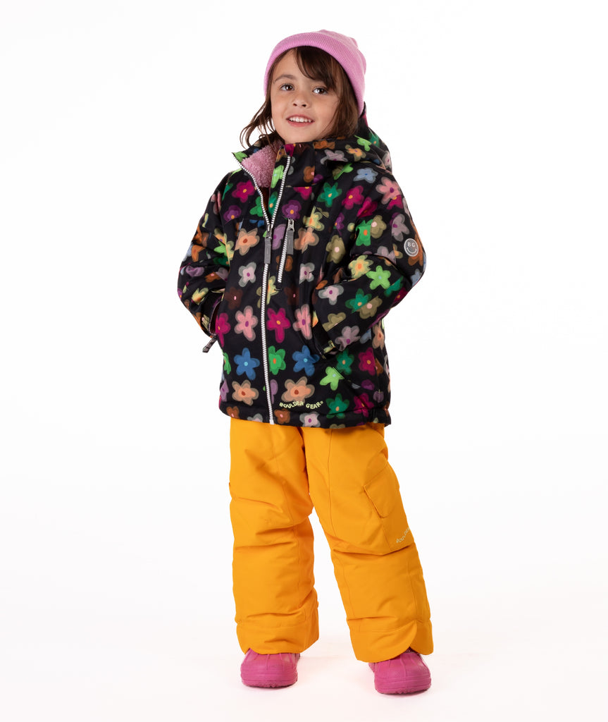 Child wearing a colorful floral patterned jacket on a white background