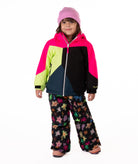 Child wearing a colorful jacket with bright pink, green, black, and navy colors on a  white background