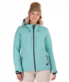 Woman wearing a light blue winter jacket on a white background