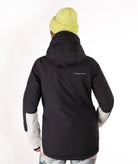 A person shown from the back wearing a black hooded jacket with light gray sleeve panels and a small white logo on the upper back, paired with a light yellow knit beanie against a plain white background.