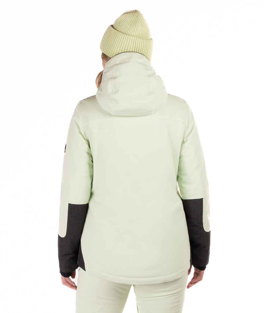 Woman wearing a two-tone light green and black checked jacket with a white background highlighting the back of the jacket and hood and sleeve details