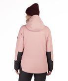 Person wearing a pink winter jacket with black check accents on a white background highlighting the back of the jacket and hood