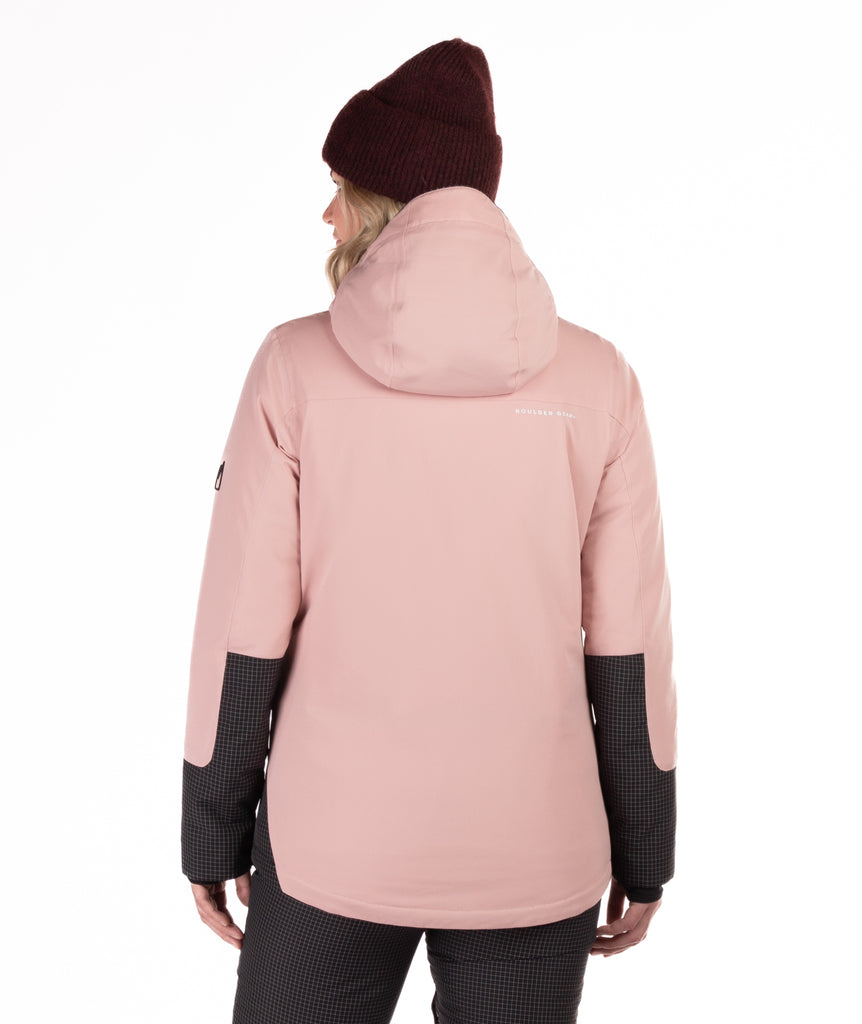 Person wearing a pink winter jacket with black check accents on a white background highlighting the back of the jacket and hood