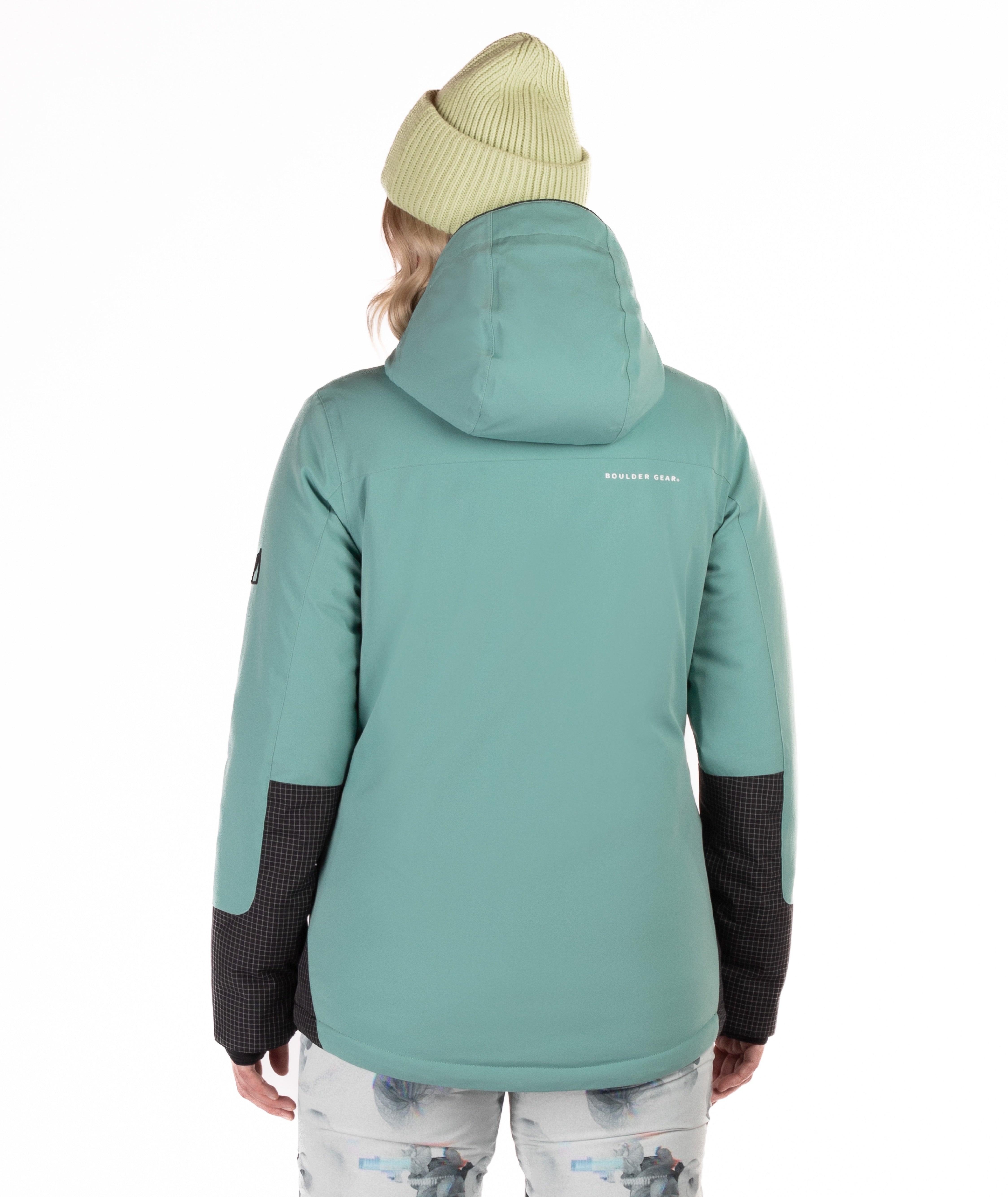 Person wearing a green jacket with black accents and a brand logo on the back, standing against a white background.