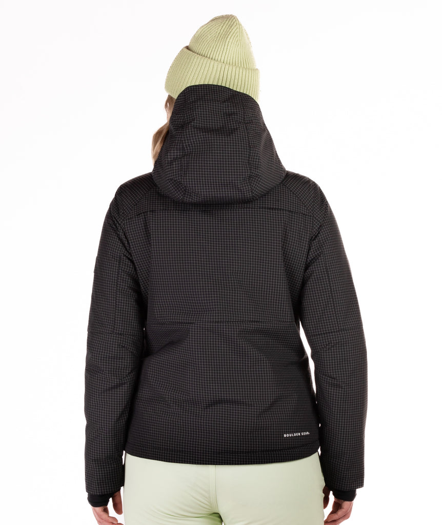 Person wearing a black checkered jacket with a hood on a white background